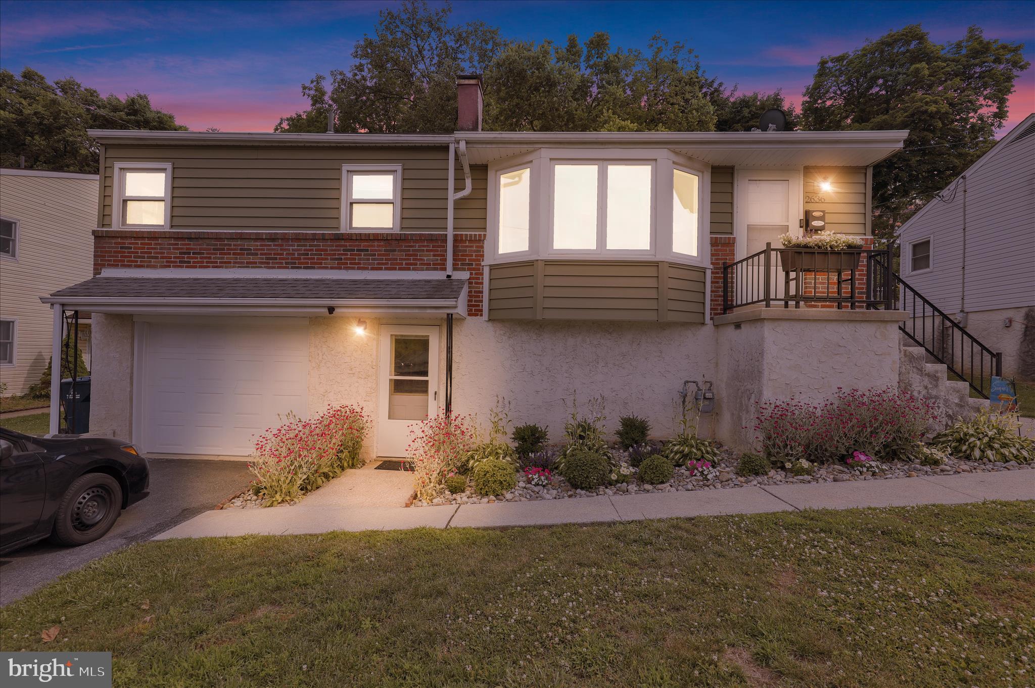 Welcome to this move in ready West Lawn gem, ideally located in the Wilson School District. Enjoy the convenience of being close to parks, shopping, dining, and everyday amenities while tucked away in a desirable neighborhood setting.

This well maintained home offers 2 bedrooms, 1 full bath, and 1 half bath on a nicely sized lot. The paid off solar panels transfer to the new owner, providing long term energy savings and added value.

A one car garage and driveway at street level lead to the lower level, which offers excellent flexibility and could serve as additional living space, a family room, home office, or potential third bedroom. This level also includes a half bath and laundry area.

The main level features beautiful hardwood flooring throughout and an expansive living room filled with natural light. The kitchen offers ample cabinetry and countertop space, making meal preparation and entertaining easy. A formal dining area and bright sunroom provide additional living and gathering spaces.

Two generously sized bedrooms and an updated full bath with double sinks and modern finishes complete the main level.

With energy efficient gas heat and hot water, versatile living space, and a prime location, this home is ready for its next owner. Do not miss this opportunity.