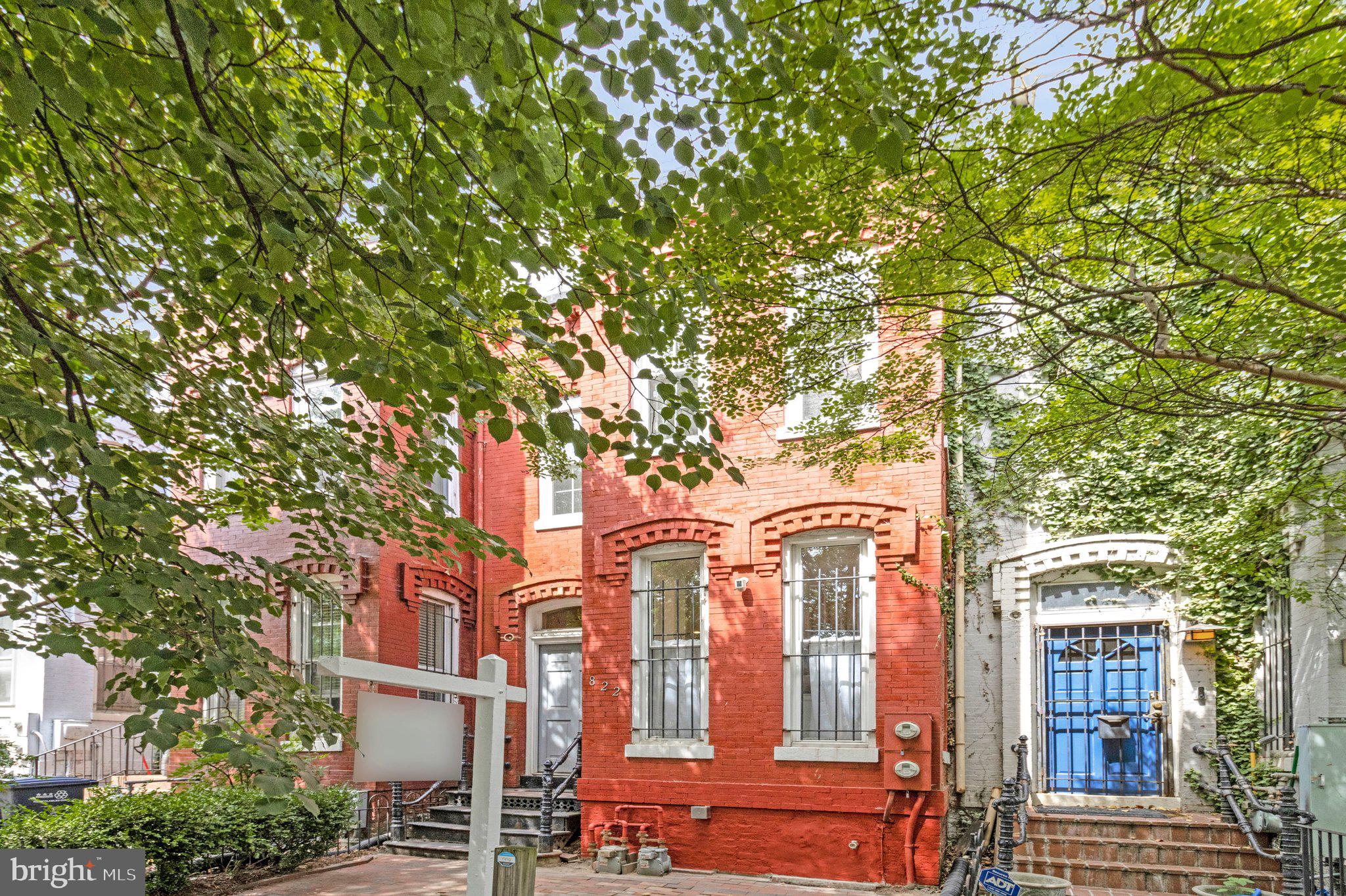 Welcome to 822 5th St NE, a beautifully renovated 5-bedroom, 2.5-bath Capitol Hill rowhome offering exceptional space and character with almost 2,500 square all above ground, amazing backyard and off-street parking!  The tree-lined street offers privacy on all 3 above ground levels, including the picturesque third floor balcony off the primary bedroom.  Step inside to the front foyer and turn into the gorgeous formal living room (just wait, there's even more living space above!), featuring a large bay window, soaring ceilings and two hallways into the formal dining room.  Do not be afraid to host your dinner parties as the dining room is fit for almost any size table and features an original tin ceiling!  The kitchen was completely gutted and fully re-designed, providing high end appliances including an oversized JennAir gas range and Zephyr range hood, custom hand-made kitchen cabinets, loads of counter space with center island, coffered ceilings, and huge picture window overlooking the back yard!  The first floor is rounded out with a renovated powder room with detailed wall paneling, and door leading to the FULL unfinished basement offering storage space galore!  The second floor provides 2 spacious bedrooms, a renovated hall bath, and a SHOWSTOPPER family room with gas fireplace surrounded by built-ins, custom mantle, and amazing wood paneled accent wall!  The top floor features a huge primary bedroom space with with two double closets and natural light flowing through the new tea balcony French doors!  A fourth spacious bedroom, fifth bedroom/office (currently open, but door could easily be re-attached) and a stunning full bathroom featuring dual sinks, custom wood cabinetry, and walk-in shower with built-in bench cap off the top floor!  More upgrades for the home include newer HVAC (2021), newer hot water heater, and wide-plank hardwood flooring throughout.  The extremely deep back yard provides plenty of outdoor entertaining space and includes a gated off-street parking space!  Everything you need is just a few steps away, including the sought-after Union Market, shopping, plenty of restaurants/bars, grocery (Whole Foods, Trader Joe's, Harris Teeter), public transportation, NoMa Metro Station, Union Station, and Capitol Hill's many beautiful parks and outdoor destinations!