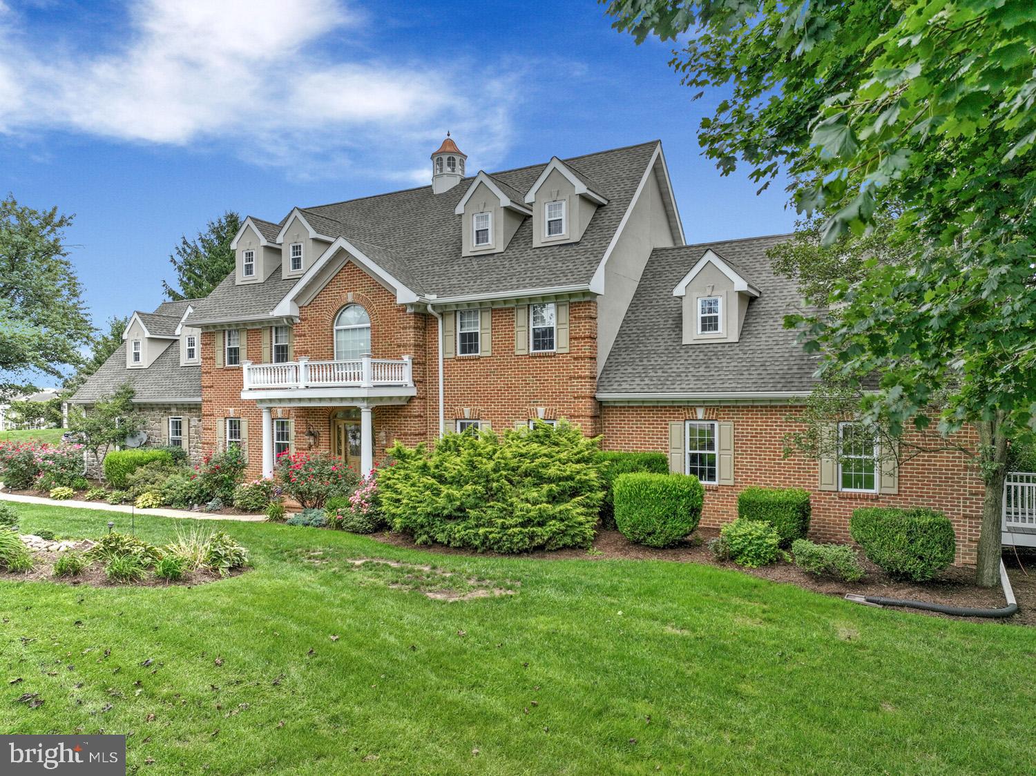Exceptional 2½-story home offering 8,589 total square feet in the Donegal School District, featuring 6 bedrooms, 4 full baths, and 2 powder rooms. Designed for both everyday luxury and unforgettable entertaining, this remarkable property showcases exceptional indoor and outdoor living spaces throughout.
The meticulously renovated kitchen is filled with natural light from an abundance of windows and features a stunning 13-foot island topped with exquisite granite imported from India, two sinks, generous cabinetry, a large walk-in pantry, and first-floor laundry. Just beyond, the home’s showstopping 48’ x 13’ covered porch becomes a true extension of the living space—overlooking the expansive patio, view of pond with fountain, and breathtaking resort-style outdoor entertaining area.
At the heart of the outdoor experience is the impressive 38,000-gallon concrete/Gunite pool, privately tucked within a completely enclosed courtyard. Thoughtfully designed in connection with the entire lower-level entertaining area, this resort-inspired setting offers the perfect atmosphere for hosting large gatherings or enjoying peaceful relaxation in total privacy.
The main level also includes a formal dining room, family room with fireplace and custom trimwork, den, and an additional flexible first-floor room ideal as an office or bedroom, complete with a private staircase leading to additional flex space above. The second floor offers 4 bedrooms, including a luxurious primary suite featuring a fireplace, study/sitting area, and large custom walk-in closets. The third floor adds 2 additional bedrooms and a full bath.
The full daylight walkout lower level was designed for entertaining on a grand scale, complete with a second kitchen, spacious dining area, and game room—ideal for hosting family, friends, business associates, or even potential bed-and-breakfast use.
Additional amenities include an attached 2-car garage, detached carriage-style 3-car garage, below-grade 1-car garage, garden area, greenhouse, and equipment shed. The 1.7-acre property also includes a charming second home built in 1858, offering approximately 1,550 square feet with 3 bedrooms and 1½ baths—ideal for a caretaker, guest accommodations, or as a tenant house generating approximately $2,000 per month in rental income.
A truly one-of-a-kind property offering luxury, privacy, and endless possibilities. Contact us today for your private tour.