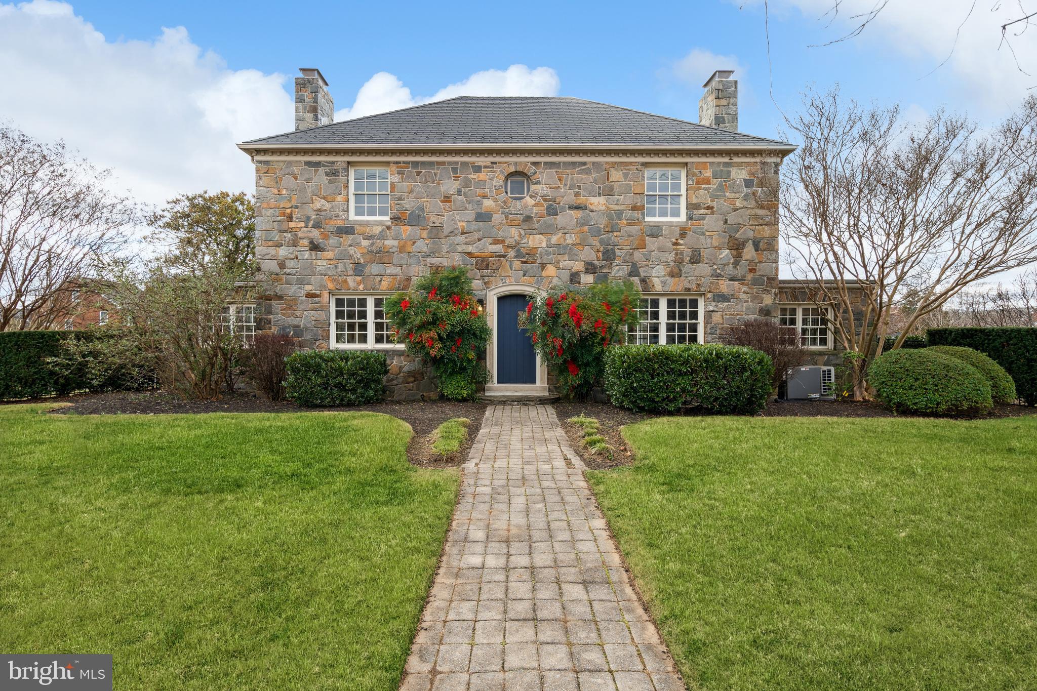 Down Rosemont, is the most exceptional opportunity to purchase a home long coveted and talked about in Baker Park. It is now available for the first time in almost thirty years. As you approach, you immediately notice the shear size of this private double lot and the quality of the stone construction. This Dutch Colonial is flanked by two chimneys, boasts a slate roof and has the most compelling appeal. Enter from the Magnolia side to a private, gated, brick driveway. As you enter, you are struck by the incredible covered rear patio. It is the perfect place to entertain, gather and create memories. The rear yard is one of the best elements of the home with wrought-iron fencing throughout and mature hedges for privacy. Enjoy evening sunsets from your private backyard retreat. Enter to an interior space that has been transformed to meet today's most discerning standards and incorporates timeless elements. The main level is elegant and features refinished hardwood floors, fresh paint throughout, new kitchen, wood soaked office and inviting living room. The kitchen has been recently remodeled with new cabinetry, quartz counters, new fridge, dishwasher and wine fridge. There is a detailed backsplash, new light fixtures and inviting dry bar. The dry bar has a wine fridge and is adjacent to a potential breakfast nook or sitting area. The kitchen flows seamlessly into the dining area. The heart of the main level is the living room which is flanked by a gas fireplace and surrounded by built-ins. It is the perfect place to gather and leads beautifully to the rear yard. Off of the living room is a formal office, that is drenched in wood and has ample windows. The main level also features a powder room and recessed lighting throughout. Upstairs features three bedroom and two remodeled bathrooms. The primary suite has exposed beams with a vaulted ceiling, en-suite bathroom and walk-in closet. The primary bathroom has been remodeled to include new tile throughout, new marble vanity and glass enclosed shower. There is an exterior door to potentially create an outdoor rooftop element. The walk-in closet expands half of the upstairs and has amble options for storage. Two additional bedrooms upstairs have refinished floors, fresh paint and are flanked by newly remodeled hall bath. The hall bath has a new pedestal sink and beautiful new shower. The wet area features beautiful glass tile and intricate hardware. One of the secondary bedrooms has an exterior door that could lead to a future rooftop element as well. The lower level has been refinished with luxury vinyl flooring, new full bath vanity, and fresh paint. The laundry room has ample cabinetry and work space. Gas furnace from 2016 and 2023 water heater. Enjoy this incredible location with walkability to Baker Park in less than one minute, ease of access to Hood College, Downtown Frederick, Culler Lake and much more.  See floor plans at end of photos. Welcome home!