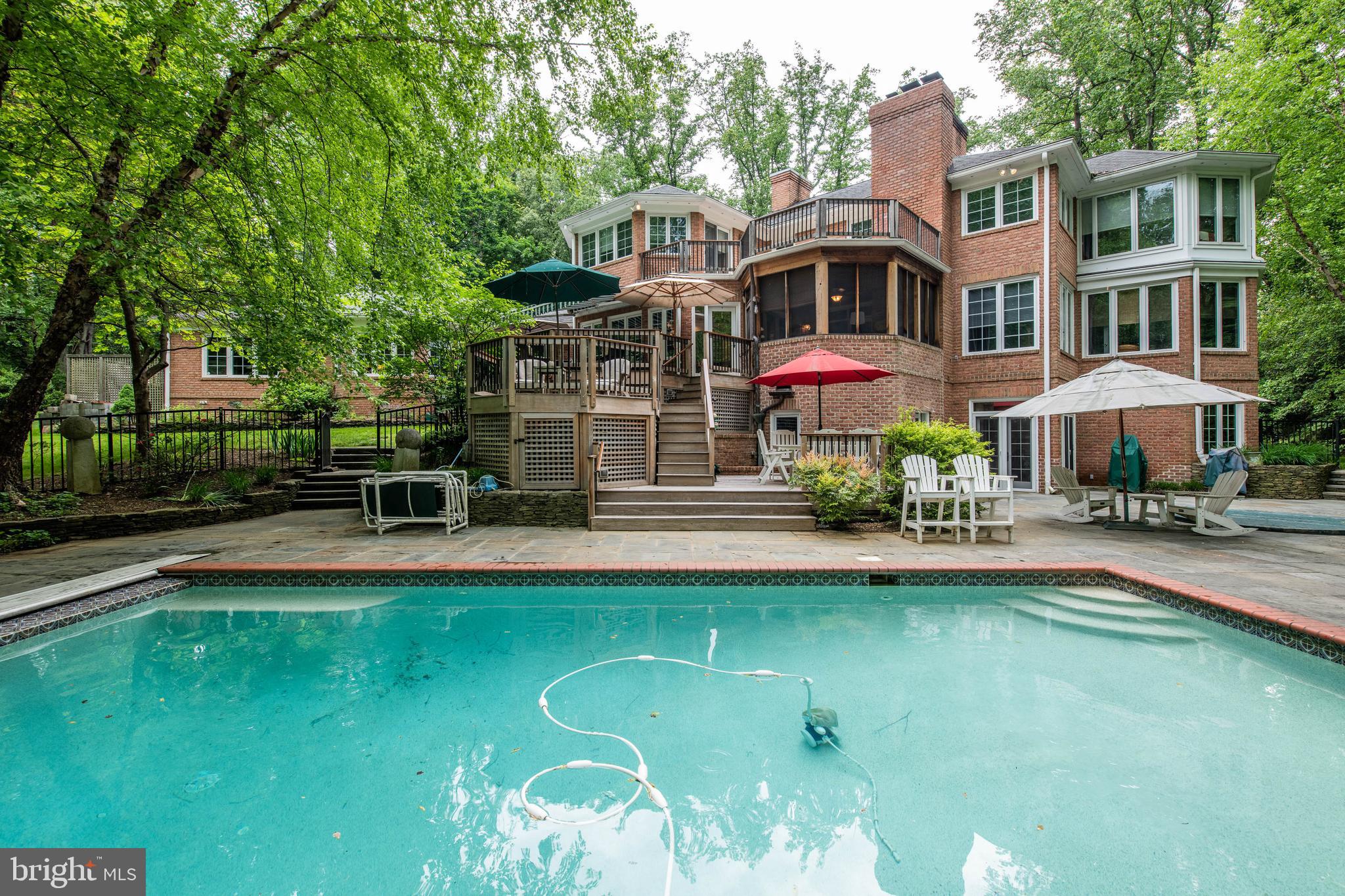 Relax and entertain indoors and out in the incredible living spaces of this sun-drenched all brick home. The lushly landscaped & wooded 1.26 acre property, with over 7100 square feet of finished living space, is located on a private cul-de-sac in the premier Annapolis area waterfront community of Poplar Point*Chef s kitchen with granite countertops & center island, two Fisher Paykel dishwashers, Wolf wall ovens & Wolf gas cooktop with Viking Hood, wine cooler, built-in 48  refrigerator*Hardwood floors throughout the home with Brazilian cherry inlay in the living room & dining room*Formal dining room with butler s pantry*Built-in speakers with individual room volume controls throughout the home   even in the garage! Elegant master bedroom with fireplace and sun room/sitting room, luxury bath*All bedrooms are spacious and have walk-in closets* Main level two room In-Law, Nanny or Au Pair suite*Immense lower level recreation room with high ceilings, projection tv/movie screen with surround sound (conveys), wet bar with mini fridge, exercise room, full bath, and wine cellar* Entertainment space galore-- Screened porch overlooking the heated pool with retractable cover, hot tub, slate patio, and multiple decks including roof-top sun deck*Poolside bath and pool equipment room*Ipe wood (Brazilian walnut) steps lead from the circular drive to the covered front porch*Deep water boat slip (with no bridges to the bay!) conveys - private marina with clubhouse & kayak/paddleboard storage*Striking brick wood-burning fireplace in the family room, two gas fireplaces plus wood stove on lower level, 3 car garage with 3rd bay oversized door to accommodate large SUV/boat/RV storage*Irrigation system*Generator plug and bypass panel*Pages of upgrades & special features in this luxurious 6 bedroom, 6   bath home   Ask your agent for a copy! Community dinner group, bridge club, frequent community association and marina association get togethers*Just minutes to Annapolis, Ft. Meade, DC, and Baltimore! Make sure to watch the video tour.