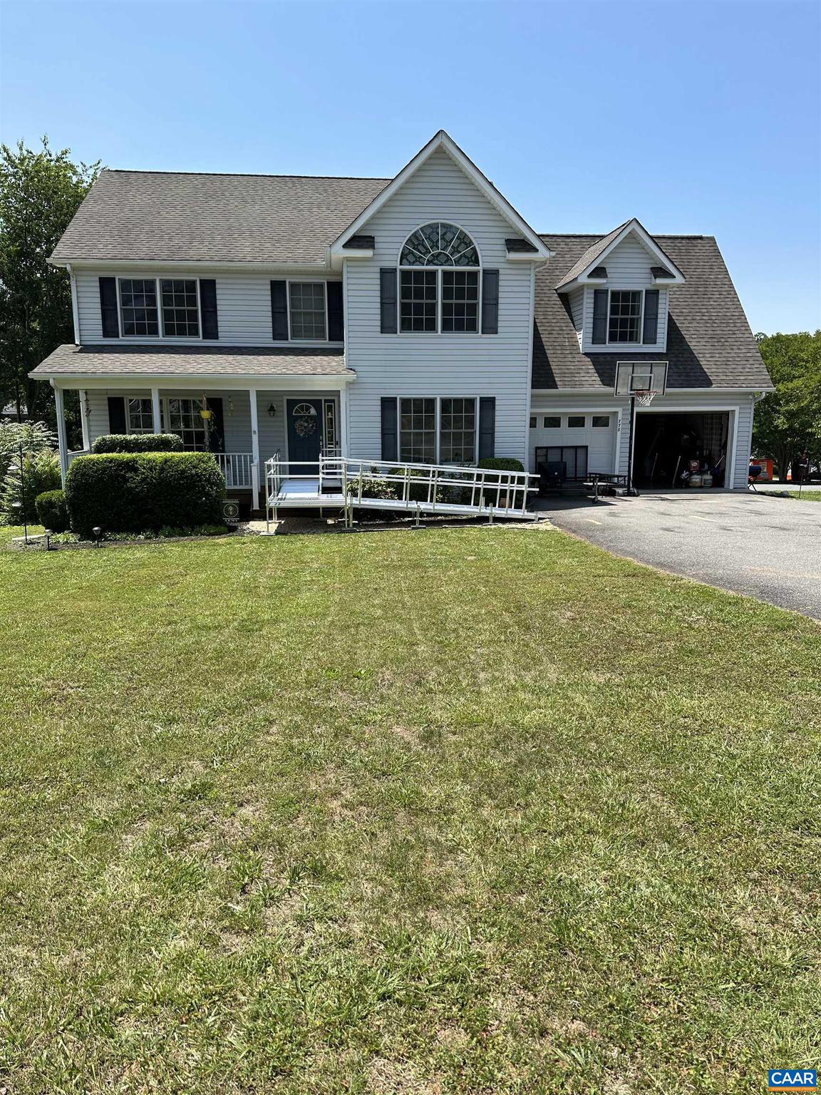 PROFESSIONAL PICTURES FORTHCOMING!  Enjoy the water views in this spacious 4 bedroom/2.5 bath colonial home.  Home features a lovely gourment kitchen with stainless steel appliances and opens up to a spacious family room and eat-in breakfast area. First floor also has a separate dining room and living room which could also be used as an office space.  Upstairs consist of four bedrooms with a spacious master suite with cathedral ceilings that attaches to a spacious master bath with ceramic floors, jetted tub, double vanities and stand up shower.  Upstairs area also has additional three bedrooms with a full shared bathroom, separate laundry room with cabinets, and plenty of storage space. The home was constructed with many custom features including arched doorways, hardwood flooring, and crown molding. Fenced in area in the rear of the home for your animals and safely enclosed play area.  When it's time to relax take advantage of Lake Monticello's various beaches, golf course, pool, tennis courts and other amenties that the commity offers.  Home is being sold "As Is", home inspection for informational purposes only - seller will do no repairs.,Formica Counter,Maple Cabinets,Fireplace in Family Room