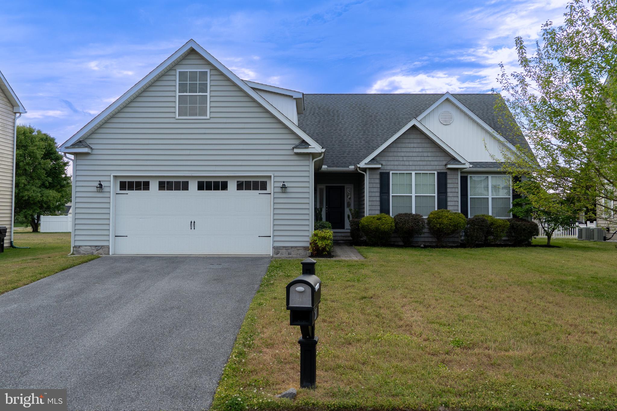 Welcome to 27 Sun Ridge Drive in the established Satterfield community located within the sought after Lake Forest School District. The house is located just 20 minutes from Dover AFB and 25 minutes to Bayhealth Medical Center in Milford. This well maintained and move-in ready home includes washer and dryer.
The kitchen features recently re-done cabinetry and stainless steel appliances, granite countertops, and a breakfast bar that seamlessly leads into a spacious living room with cathedral ceilings and recessed lighting allowing for plenty of natural light.
The primary bedroom features a walk-in closet and en-suite bath with double vanities and a shower stall. The guest bathroom also features double vanities and a bathtub.
The house also features an oversized two car garage and an unfinished second floor that provides ample storage space.
Out back, enjoy a stone patio with the fire pit and a fully fenced yard.
The house is ready for its next chapter with a new family.