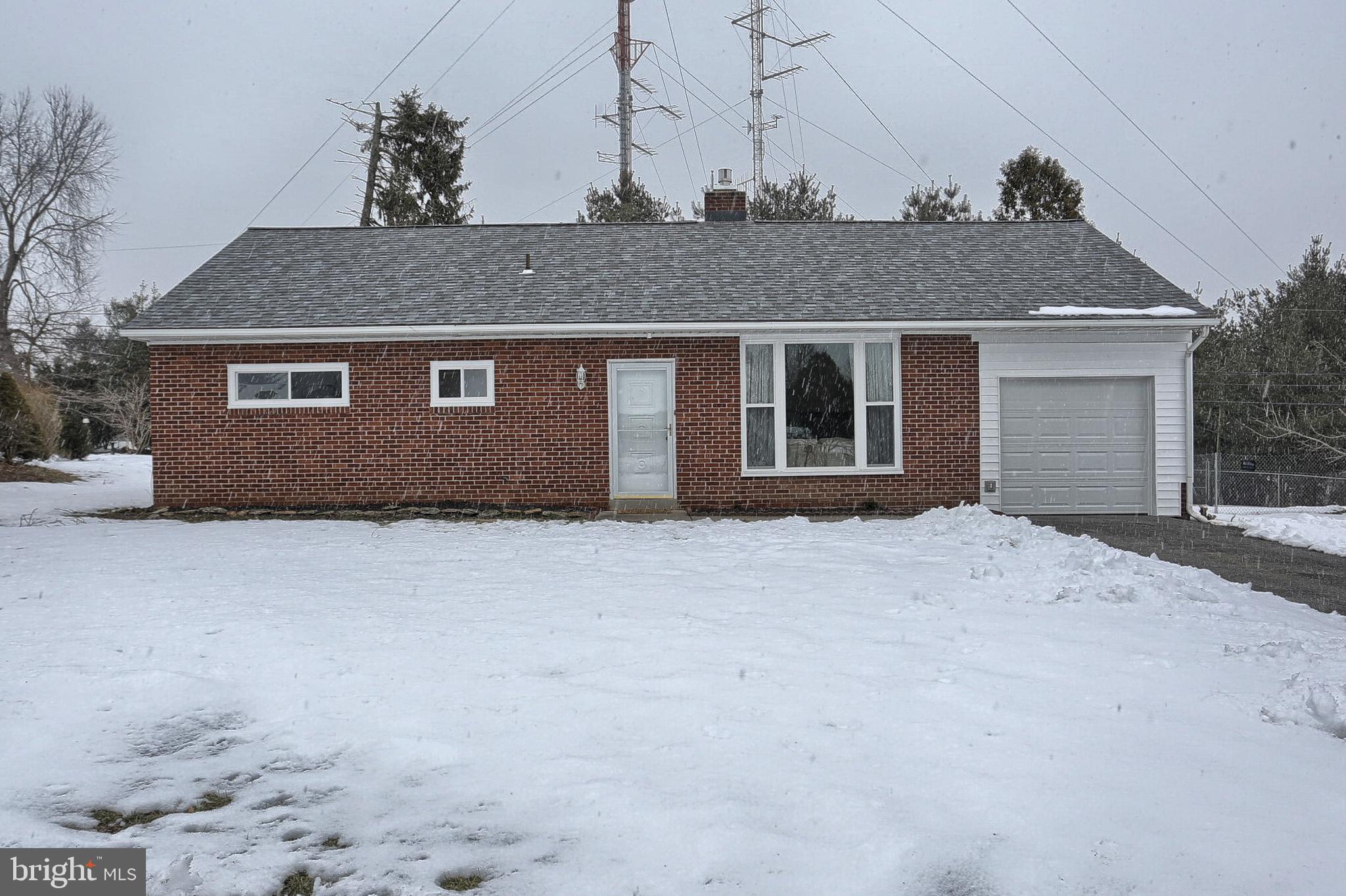 Solid brick 1-story rancher in quiet Penn Manor neighborhood, 3 bedrooms, 1 1/2 baths, Many updates...  Updated kitchen cabinets, backsplash, & countertops, new heating system, new roof, new windows, new flooring & paint throughout, new gas fireplace, new garage, eat-in country kitchen, Living room with brick fireplace, & big picture window, updated bathrooms, large flat back yard to entertain family & friends.