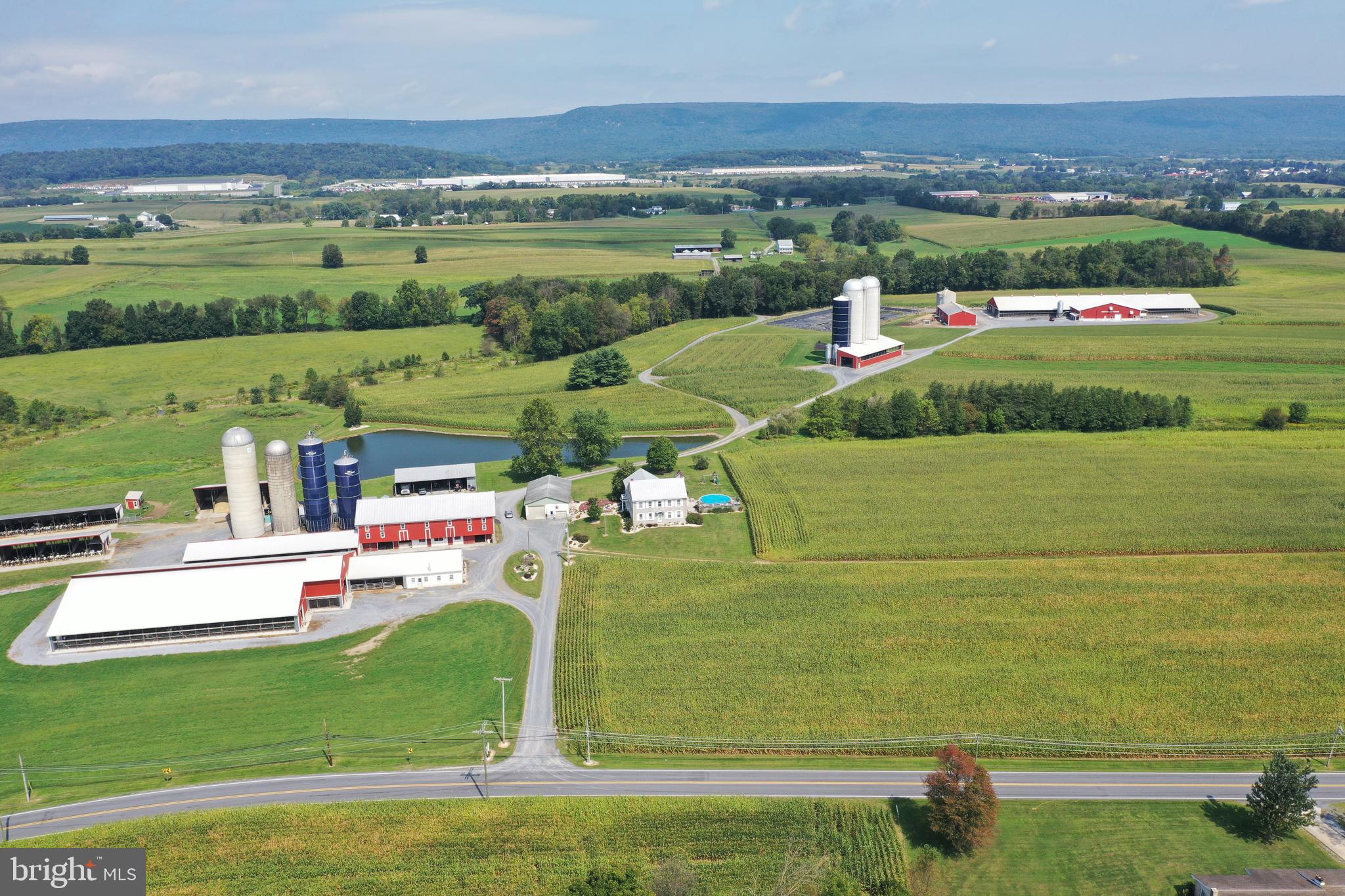 127-acre modern dairy farm with (4) model A-3 Lely robots. Insulated barn includes 223 freestalls, Norbco alley scrapers, and Petersheim pasture mats. Milk house features 7,000-gallon Mueller milk tank with radiant in-floor heat. 156-stall dry cow and bred heifer barn. Calf barn that accommodates 50 calves. 50-head heifer barn with 6 pens built in 2009. 14 pen slatted floor heifer barn built in 1991 can accommodate 98 heifers. Includes a manure digesting system and separator barn. 2 feed areas accommodating 7 silos with conveyors all under roof. All for just $3,250,000. Or buy the entire 305-acre farm for $5,000,000.