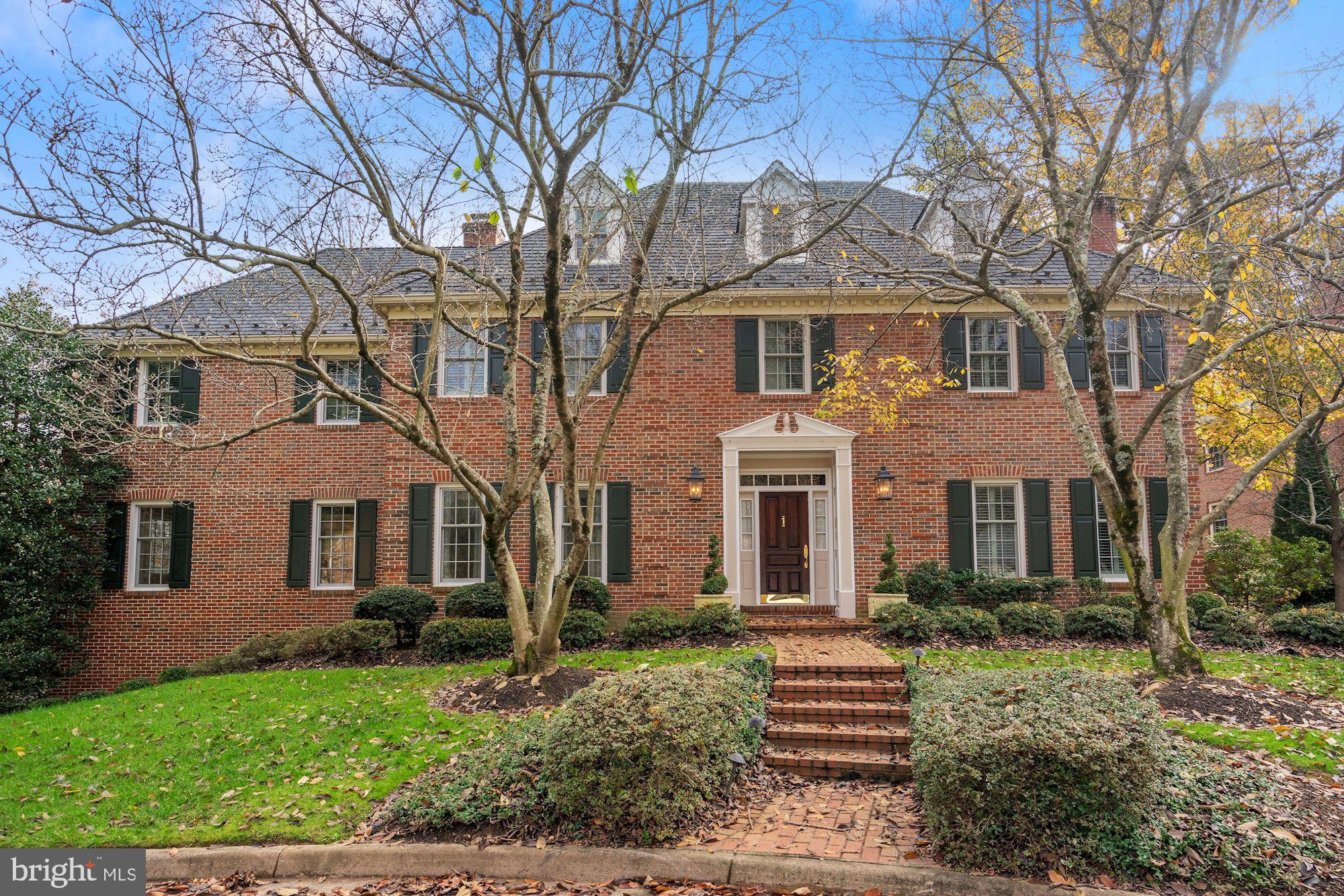 This gorgeous home on this deep lot,  backs to Bullneck Park where there is a stream and walking paths.  There used to be a horse trail and there is much to explore in these woods. Plus there is the  Recreation Center and Athletic Fields  just a few blocks away! Walk to local shops and LoKL Gourmet restaurant/deli which offers live music on week-ends. This beautiful brick colonial is in the PERFECT LOCATION. , AND, it is at the end of a quiet cul-de-sac  and features over 6,000 square feet of living space over four levels with five bedrooms and five and a half baths. With a versatile and light-filled floor plan, this home was designed for luxury living and easy entertaining. The five fireplaces provide a wonderful atmosphere, as well as warmth. The main level features a two-story foyer, a living room with a gas fireplace, a gourmet kitchen with granite countertops and high-end appliances including a gas Wolf cooktop and a SubZero refrigerator/freezer. Adjoining the kitchen is the family room with a fireplace, wet bar and French doors opening to the deck. Additionally there is a cozy den with built- ins, a powder room and an expansive great room (20x20) with walls of windows, a fireplace and French doors leading to the deck with sweeping views of the private backyard. Upstairs, the owner's suite offers a large bedroom, a sitting room with a fireplace and built-ins, a walk-in closet and an en suite bath with multiple vanities. Three additional bedrooms, two full baths and a bedroom level laundry room complete this level. A sizable third level loft space features a skylight and full bath. The walkout lower level offers a flexible floor plan with a large recreation room, an office, full bath, dark room and additional storage. The expansive backyard lawn has lush landscaping and beautiful plantings that provide year-round privacy..