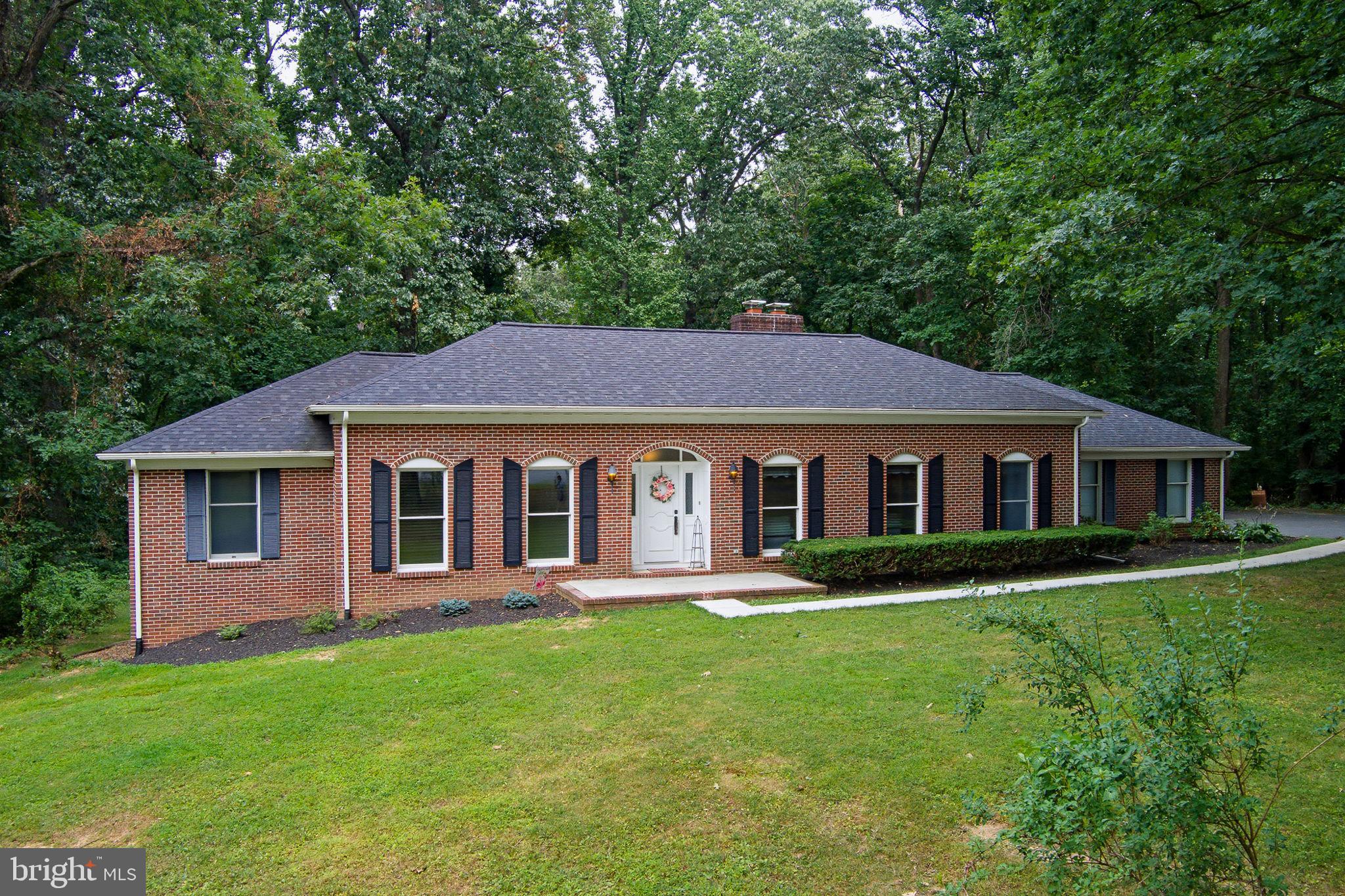 Nestled at the end of a tranquil cul-de-sac, this custom-built all-brick rancher offers timeless appeal. Situated on a two and a half acre private lot backing to mature trees, this home offers the perfect blend of quality craftsmanship, comfort and outdoor living. Inside you will find 4 bedrooms, 2 full baths and 1 half bath, along with a thoughtfully designed floor plan ideal for living and entertaining. There are multiple living areas. The expansive finished lower level provides additional living space-perfect for a recreation room, multigenerational living, home theater, gym, hobby area or entertaining. The home has numerous updates including: roof, gutters and gutter guards (2022), sidewalks, (2025), garage floor (2025), garage door openers (2023), water heater (2025), HVAC compressor (2026), cooktop and oven (2026), microwave (2023), water softener tank (2025), well pressure tank (2023) and a well pump (2024).  An Azek deck and an above ground pool are perfect for summer fun. If you have been searching for a custom-built brick rancher with acreage, privacy and room to entertain, this home checks all the boxes. Don't miss this opportunity to own a property in the desirable location of Jarrettsville. Schools-Jarrettsville Elementary, Fallston Middle and Fallston High. There are so many possibilities with this home.