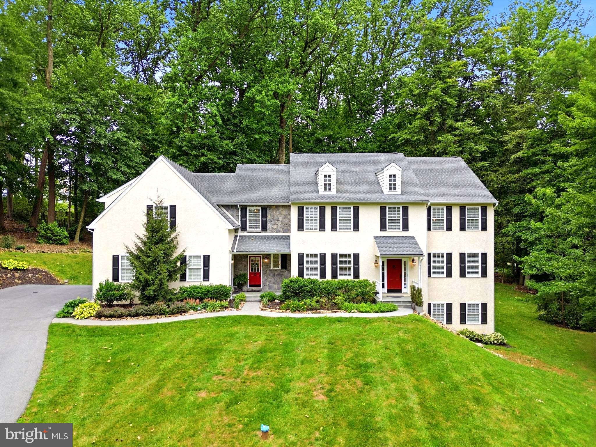 Welcome to 661 St. Matthews Road – a meticulously updated custom home set on a picturesque 1.3-acre lot in Chester Springs, offering easy access to Route 100 and the PA Turnpike for effortless commuting. Just minutes from Ludwig's Corner, you're close to charming shops, restaurants, and the Ludwig's Corner Horse Show Grounds, plus convenient to Downingtown, Exton, and the many parks, trails, and open space that define the area's rural, horse-country charm.
This home has been extensively upgraded from top to bottom. Mechanicals include two propane furnaces and two AC units (1st floor heat 2019, 2nd floor heat 2023, AC 2019), well pump and pressure tank (2021), hot water heater (2016), whole-house generator (2020), and a roof replaced in 2015.
The kitchen features updated granite counters and backsplash (2020), professionally painted cabinets by Morton Painters (2022), plus included dishwasher, built-in café microwave, and refrigerator. New plank hardwood flooring spans the entire first floor (2021), with luxury vinyl plank in the basement (2021) and new carpet in the formal living room, office, front and back staircases, hallway, and basement. The entire interior was freshly painted in 2021 (additional painting 2022), and all four bedrooms received new carpeting in 2026.
The finished walkout basement adds an additional 1000 sq ft of versatile living space, complete with luxury vinyl plank flooring and direct outdoor access — ideal for a media room, gym, playroom, or additional entertaining space, and offering excellent natural light thanks to the walkout design.
Outside, enjoy a spacious Trex deck (2022) and a widened driveway (doubled in size) accommodating 5+ vehicles plus the 3-car garage.
A fully finished in-law suite with its own separate entrance (2016) offers a private living room, bedroom, full bath, and bonus office space — perfect for multigenerational living or guests.
A rare opportunity to own a home where nearly every major system and finish has already been taken care of. Schedule your showing today!