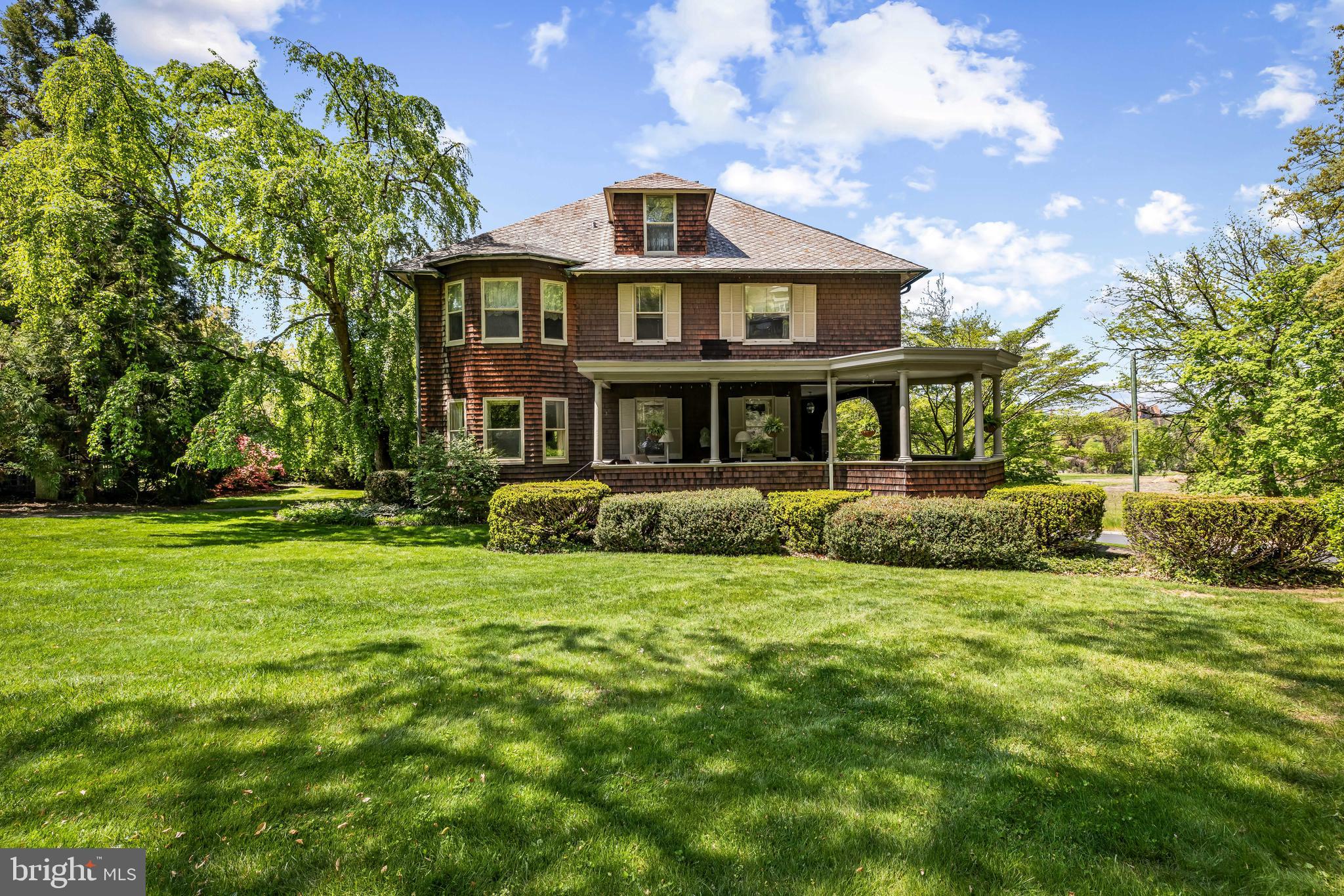 OFFER DEADLINE: Best and final offers due FRIDAY, MAY 15th at 3:00PM.

Timeless 1904 Roland Park home, offered for the first time in over 50 years. 4 Hillside Road has been thoughtfully cared for by just four owners, reflecting a rare sense of continuity and pride of ownership. Ideally positioned, the home overlooks the new Hillside Park and offers easy access to the scenic footpaths of Roland Park leading to Roland Avenue.

Featuring 5/6 bedrooms and 2.5 baths, the home offers generous living spaces, original architectural details, and a layout that blends historic charm with everyday livability. Original wood flooring is a true highlight—featuring turn-of-the-century Edwardian parquet with a decorative double inlay border. High ceilings and beautifully proportioned rooms create a warm and inviting atmosphere throughout.

The main level offers exceptional living space, including a formal living room overlooking the wraparound porch, a cozy library with a wood-burning fireplace and floor-to-ceiling shelving, and a bright and cozy sunroom providing a perfect third living area. A large, gracious dining room connects to a charming butler’s pantry that doubles as a bright breakfast room, leading into the kitchen. A walk-in pantry adds storage and functionality.

The second level features four large bedrooms and two full baths. The primary bedroom has a dedicated dressing room, easily converted to a walk-in closet or enjoyed as-is. Each additional bedroom has its own bit of charm and personality- one bedroom features a fireplace, while another showcases an elegant circular bay window.

The third level includes a fifth bedroom and a flexible sixth bedroom or bonus space, complete with an original clawfoot tub and vintage sink—ideal for guest space, studio, or retreat.

Outdoor living is just as special, with a large wraparound porch overlooking a spacious, flat yard—perfect for relaxing or entertaining. Long enjoyed with hanging ferns and peaceful views, it offers a true extension of the home. The property is surrounded by lush, mature plantings of azalea, lilac, and viburnum, creating a picturesque setting that enhances the home’s timeless appeal. A detached two-car garage, accessed via the rear alley, provides added convenience.

All within walking distance to the revitalized Cross Keys and the shops and restaurants along Roland Avenue, this location offers both charm and convenience. Set in one of Baltimore’s most sought-after neighborhoods, this is a rare opportunity to own a piece of Roland Park history while making it your own for years to come. Central air conditioning on 2nd and 3rd floors only.
