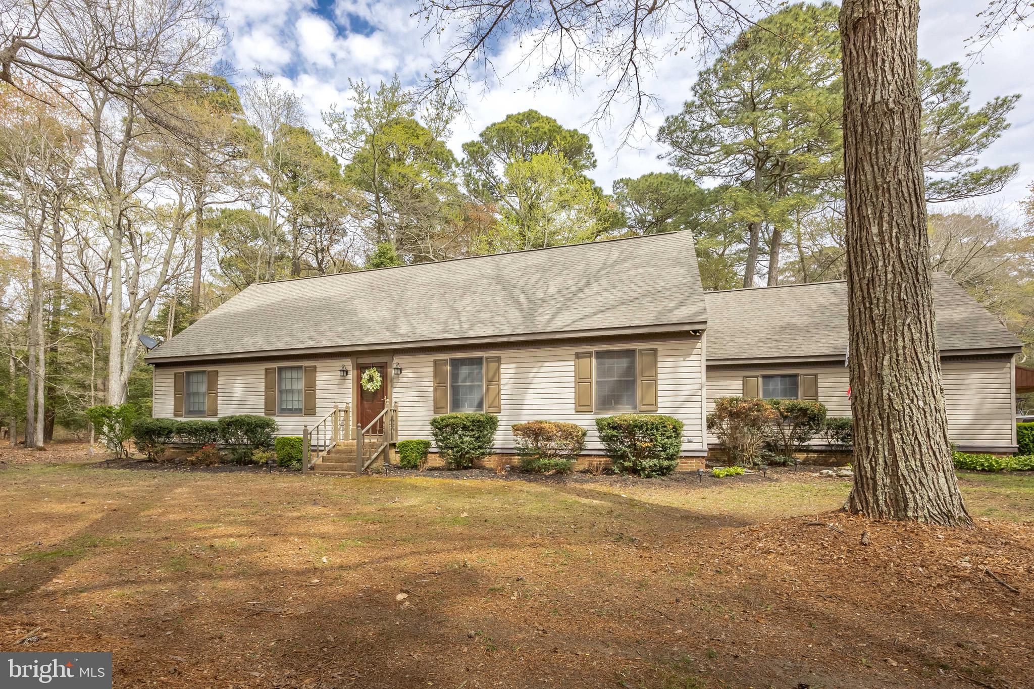 Welcome to 3889 Kingsbury! This 4 Bedroom 2 Bath gem sits on a wooded 2-acre lot! At nearly 2300 SF this home has plenty of elbow room for all! The spacious living room is great for entertaining or start the gas logs in the fireplace for a cozy feel. The open kitchen/ dining area makes serving group gatherings a whiz! Utilize the SS Appliances, Center Island, and upgraded lighting as you serve up the cuisine of your choice. The existing hardwoods are well maintained and new LVP is is the additional downstairs areas and bathroom. There are two first floor bedrooms for your convenience and a full bath as well. Upstairs you'll find two additional bedrooms with plush carpeting and a second bathroom for guest lodging or a family on the "grow"! Walk out onto the oversized screened back porch for some peace and quiet or take a stroll around the wooded tree line to take the edge off.  The spacious garage and outbuildings make for great storage or a place to do those special projects. The Open Shed is tall and wide enough to store both a camper and a boat under!!! The roof is also less than 3 years old! Book your showing today!!!