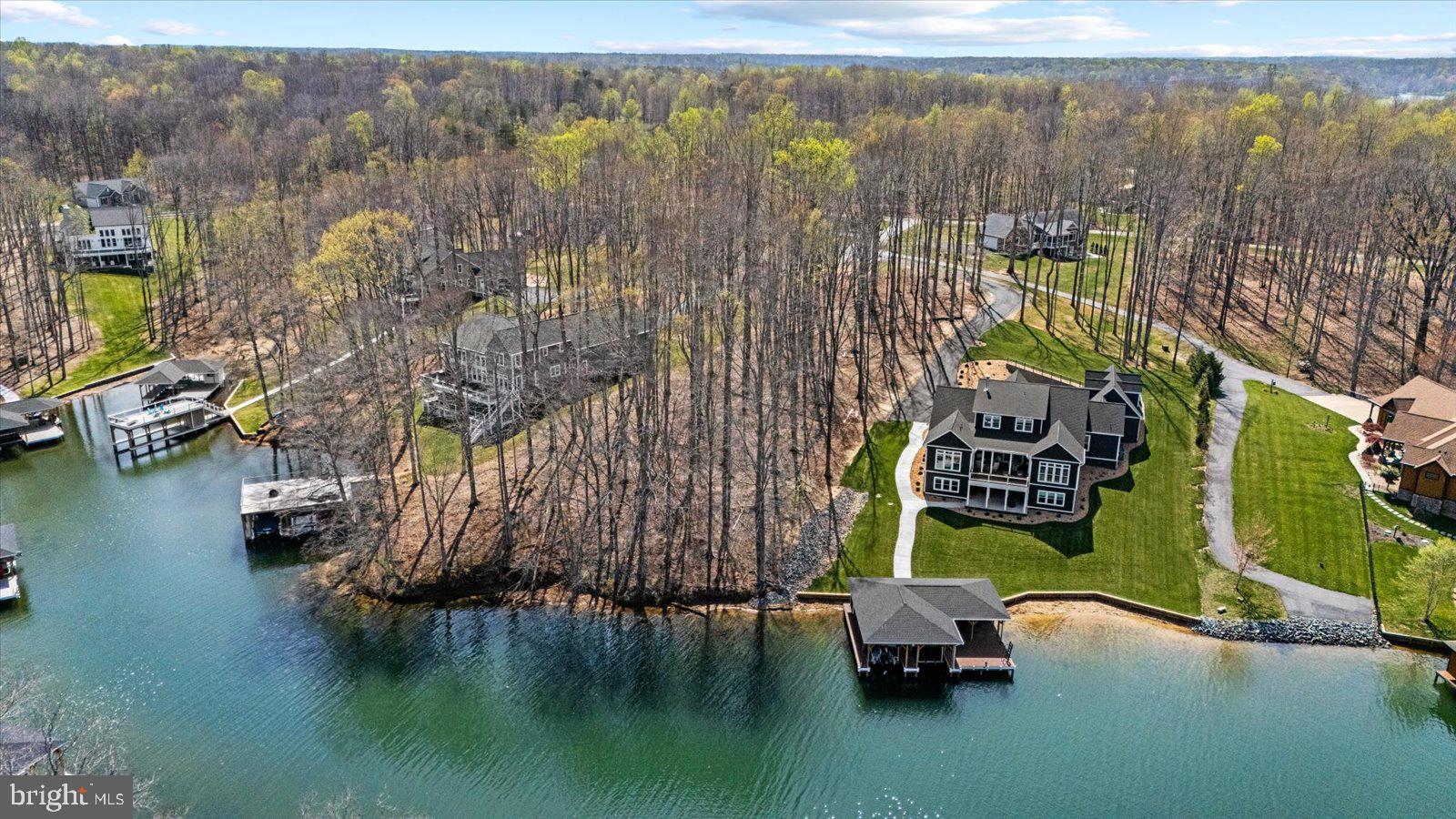 Welcome to Lot 57 Deep Creek Circle on the private side of Lake Anna—a rare opportunity to build your dream waterfront retreat in the sought-after Mill Run community.

Nestled on a peaceful cul-de-sac, this beautifully wooded 1.07-acre lot offers a tranquil setting with long water views of 164 feet of water frontage and a gently sloping topography—ideal for a home with a walkout basement and expansive lake-facing windows. The cul-de-sac lot is thoughtfully positioned to allow for a home site closer to the shoreline, maximizing both views and accessibility to the water.

Enjoy the best of lake living with deep water for boating along with a shallow, sandy shoreline perfect for swimming and relaxing. Whether you're envisioning a full-time residence or weekend getaway, this property offers the perfect blend of privacy, natural beauty, and recreation.

Mill Run residents benefit from community amenities including lake access, boat ramp, common areas, and waterfront privileges, enhancing the overall lifestyle and value. Bring your builder and start planning your custom lake home—this is Lake Anna living at its finest.