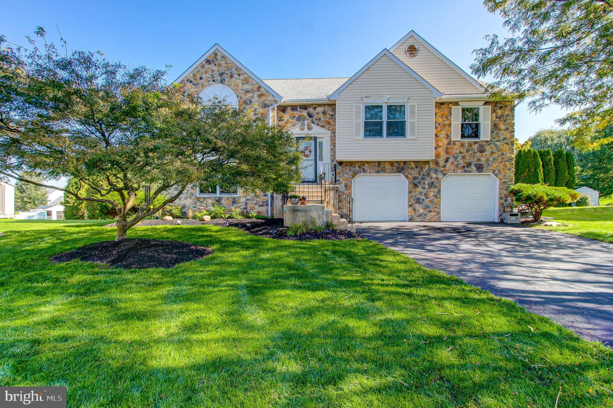 This absolutely beautiful 4 bedroom, 3 bath home is located on a quiet cul-de-sac in desirable Cabin Run Estates. As you enter, you are immediately welcomed into the fabulous foyer that features decorative wainscoting and the chandelier adds a warm glow. The In-Law Suite can be accessed from the foyer and a separate entrance from the two-car garage makes this a private space. The main level floor plan allows the entertaining to flow from the living room with cathedral ceiling into the dining room. The kitchen has all the upgrades you could want including stainless steel appliances, double oven, granite counter-tops, cherry cabinetry with pantry cabinet and lazy-susan. Down the hall is the primary bedroom that features a vaulted ceiling, wood flooring and a spacious walk-in closet! You will love the recently upgraded ensuite bath with porcelain tile flooring, granite vanity with dual sinks, marble tiled shower, and a luxurious soaking tub! Two additional bedrooms with wood flooring and ceiling fans share a nicely updated hall bath. The lower level has a kitchen, 4th bedroom, full bath with walk-in shower, and family room with pellet stove. There is a door from the kitchen into the 10x14 storage room and another door provides secondary access to the garage. French doors lead out to a concrete patio that's perfect for entertaining. Recent updates include: Updated Kitchen and New Roof in 2014. Lennox heat pump with UV light system was installed in 2013 and has been yearly serviced. Water meter was upgraded in 2022 and replacement windows installed on the front of the house. There is plenty of shopping nearby and Doylestown is minutes away. Central Bucks School District!