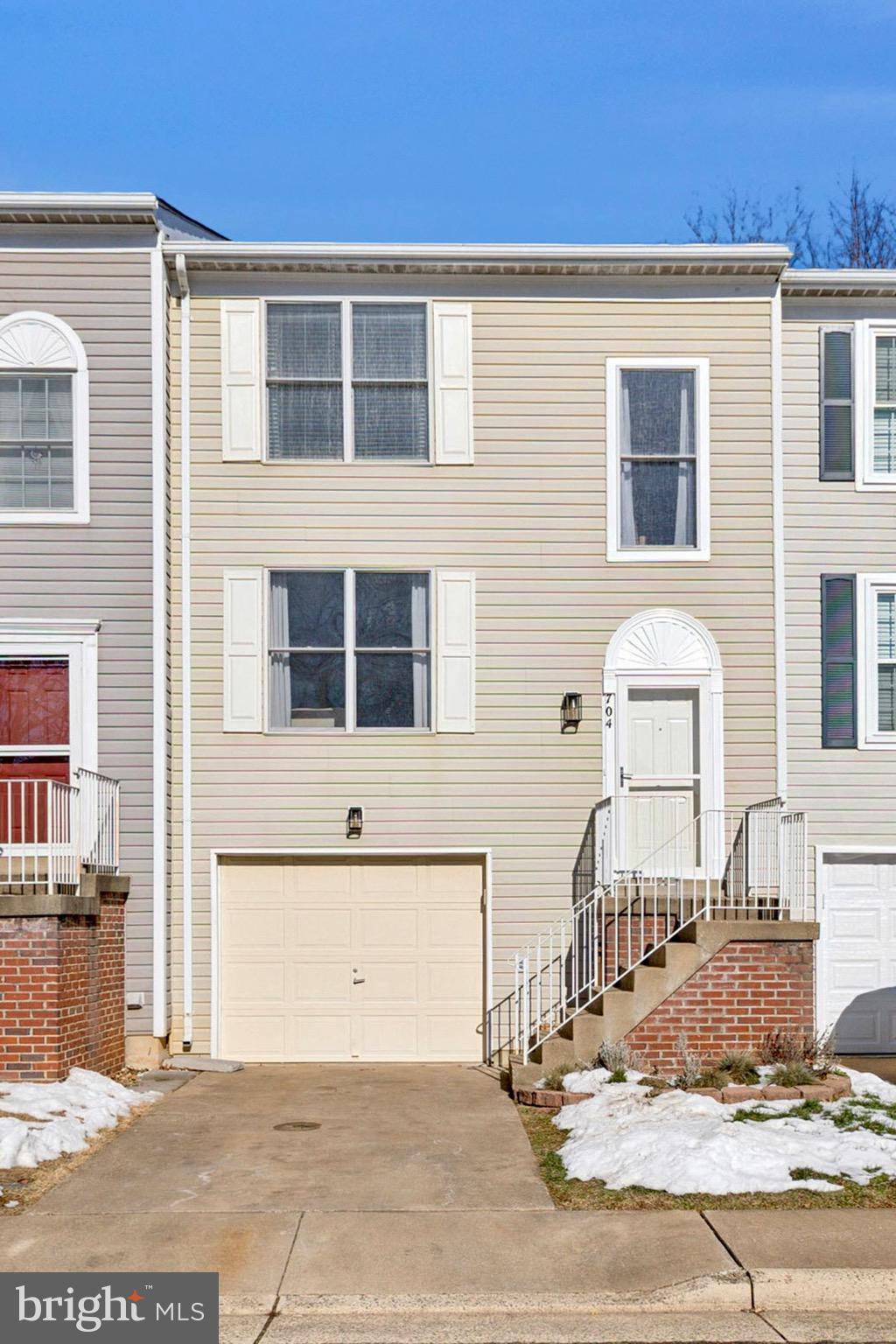 This beautiful 3-level townhome is in Leesburg and is perfectly situated just minutes from Downtown, offering convenient access to restaurants, shopping and more!  With 3 bedrooms and 3.5 baths, this home showcases Hardwood Flooring, Updated Lighting & Ceiling Fans, a Finished Lower Level with new contemporary Flooring, Deck, a Double-Sided Gas Fireplace and more!  The Double-Sided Gas Fireplace is featured in the Kitchen and Family Room!  On the Main Level, you will find the Family room, Eat-In Kitchen and Half Bathroom!  The Spacious Eat-In Kitchen includes a Dining Area, Island, SS Appliances and more!  From the Eat-In Kitchen you have direct access to a Large Deck – great for outdoor entertaining!  The Family Room offers wonderful natural light and built-in shelving that compliments the fireplace.  Upstairs you will find the Primary Bedroom En-Suite along with 2 other bedrooms, the 2nd full bathroom and Bonus Laundry Area (washer/dryer in home).  In the Primary Bedroom En-Suite you will enjoy a Walk-In Closet and Private Full Bathroom.  The finished walk-out basement offers the 3rd Full Bathroom, Recreation Room with stylish Modern Barn Door, and direct access to the Backyard which boasts a beautiful brick paved patio…a perfect place to relax and enjoy the outdoors!  Convenient parking with Attached Garage, driveway, and visitor parking!  BONUS:  New Carpet being installed, Wood floors being refinished!