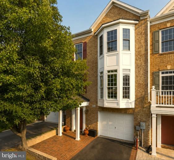 🏡 Welcome to 8913 Lee Manor Drive — a beautifully maintained brick-front townhome with a sought-after three-level bump-out that is truly move-in ready. A charming portico entry sets the tone as you step inside to pristine interiors, gleaming hardwood floors, and a bright, open main level designed for both everyday living and entertaining.

☀️ The spacious living room is filled with natural light and showcases a transom-topped bay window, elegant crown molding, and chair rail detailing.

🍽️ The gourmet kitchen is sure to impress with crown-topped cherry cabinetry, sleek granite countertops, center island, stainless steel appliances, and an adjoining breakfast area with direct access to the low-maintenance deck — perfect for morning coffee or evening relaxation.

🛏️ Upstairs, the luxurious primary suite features a cathedral ceiling, stately columns framing a private sitting area, walk-in closet, and spa-inspired bath with double vanity, jetted soaking tub, separate shower, and plantation shutters. Additional bedrooms offer soaring vaulted ceilings, double closets, and one with a charming bay window.

🔥 The versatile lower level includes a spacious recreation room or optional fourth bedroom complete with a private full bath, cozy gas fireplace, and walkout access to the patio.

📍 Ideally located between the charm of Ellicott City and the conveniences of Columbia, you'll enjoy easy access to shopping, dining, and entertainment.

✨ This is the perfect place to call home!