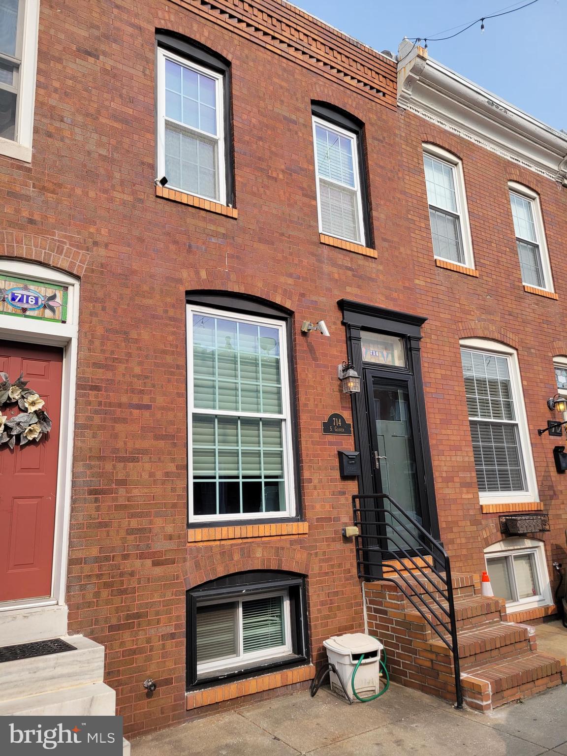 Gorgeous fully renovated Canton home on a great block! This home has a contemporary feel with a wrought iron staircases with open risers to the second level, cherry hardwood floors, exposed brick throughout and recessed lighting. Gourmet kitchen with stainless steel appliances, granite counters, pantry cabinet, slate backsplash and floors and a peninsula with seating for three. Two generous sized bedrooms on upper level with renovated hall ball. Deck off second bedroom with stairs to rooftop deck with great city views. Fully finished lower level with full bath. Patio off rear of home.