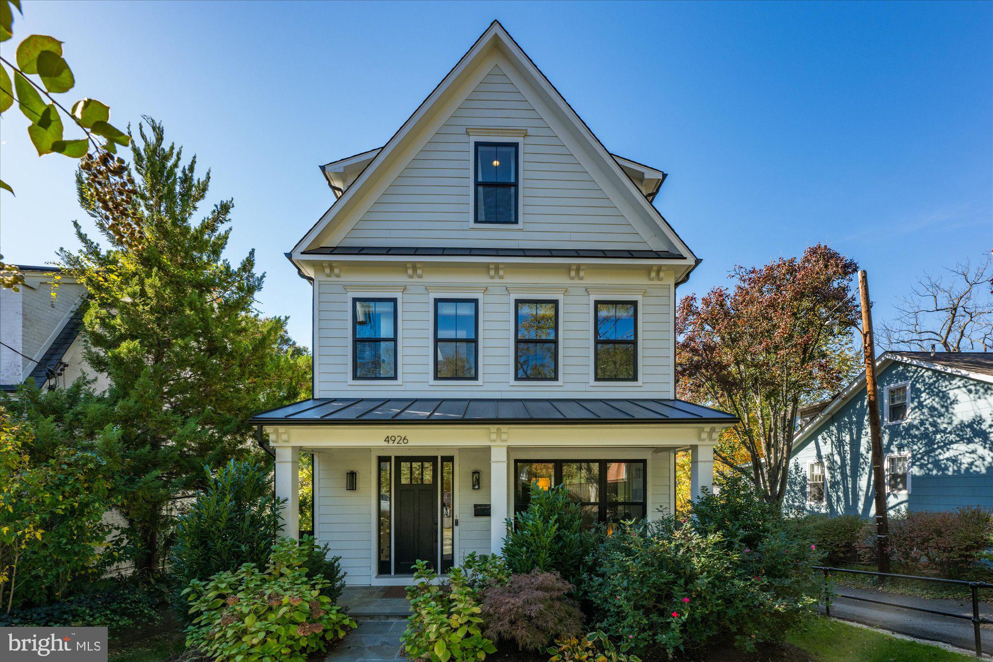 Welcome to 4926 47th Street, NW, an exquisite 4,500 sqft AU Park treasure built in 2020 by Beacon Crest Homes and thoughtfully enhanced by its current owners. This stunning residence blends timeless design with modern luxury, offering five bedrooms and four and a half baths across four beautifully finished levels.

Upon entering, you are greeted by a bright, open floor plan featuring soaring 10' ceilings, rich hardwood flooring, and designer finishes throughout. The main level offers a formal parlor/office, an elegant dining room with upgraded light fixtures, a convenient butler's pantry, and a gourmet kitchen equipped with top-of-the-line appliances, custom cabinetry, an expansive island, and a cozy built-in banquette in the eat-in kitchen area. The kitchen flows seamlessly into a spacious, sun-filled family room with a cozy gas fireplace, flanked by custom bookshelves. Just off the kitchen, a rear mud entrance offers convenient access to the backyard and is equipped with custom storage.

The second floor showcases a luxurious primary suite complete with two walk-in closets, custom storage solutions, and an oversized spa-like bath. Two additional generously sized bedrooms share a connecting bath, and a well-appointed laundry room adds convenience to this level. The third floor serves as a versatile retreat, featuring a sun-drenched study/playroom, an additional bedroom, and a full bath, all enjoying abundant natural light from multiple windows. The fully finished lower level offers 9' ceilings, a large recreation room with a stylish dry bar, corner gas fireplace, a private bedroom, a full bath, and a dedicated media room—perfect for movie nights or hosting guests.

Outdoor spaces are equally impressive, with a rear deck and staircase, a professionally hardscaped patio with a sitting wall, backyard plantings, and a fenced backyard providing privacy and space for outdoor relaxation. More exterior highlights include a storage shed, an EV charger, and a back-alley parking pad for added convenience.

Additional home features include an elevator rough-in for future accessibility, smart home technology, custom closets in all bedrooms, a whole-house water filtration system, and thoughtful upgrades throughout.

Ideally located just moments from the vibrant shopping, dining, and recreational offerings of the Wisconsin and Massachusetts Avenue corridors (only 1/2 mile to the Friendship Heights Metro station!), as well as nearby parks and several neighborhood schools, this home offers the perfect balance of luxury, convenience, and community living. Don't miss the opportunity to make this exceptional property your own! Welcome home!