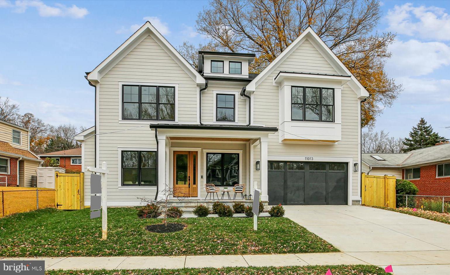 100% compleded! Welcome to 11013 Stillwater Avenue, built by esteemed builder, ERB Properties! This extraordinary home offers an amazing open floor plan with 3 finished levels, 5 bedrooms, 6 bathrooms and over 4,800 square feet of living space! Featuring beautiful craftsmanship and finishes with generous-sized rooms, abundant recessed lighting and wide plank hardwood floors, it is ready for you to move right in! The main level includes a living room, formal dining room, gourmet chef’s kitchen with high-end stainless-steel appliances, soft close cabinets and drawers, quartz countertops, island with waterfall counters and a walk-in pantry. The main level also features a light and bright family room with a gas fireplace and built-ins, an office, a full bathroom and a large mudroom with cubbies and benches. The spectacular upper level boasts a primary suite with two walk-in closets and a luxurious spa bathroom with a separate oversized frameless glass enclosed shower, a soaking tub and two sinks. Also on the upper level are 3 additional bedrooms, 3 additional full bathrooms, a lovely, open family/homework-study area and a laundry room with a sink, cabinets and washer and dryer. On the spacious lower level you will find a recreation room with a wet bar and beverage refrigerator, a 5th bedroom, a 6th full bathroom, an exercise room with rubber mat and mirror, additional storage space and a separate walk-up side entrance. Additional features include an attached two car garage and a patio off of the family room! Located in the lovely Garrett Park Estates subdivision, this home is part of the Walter Johnson High School cluster.