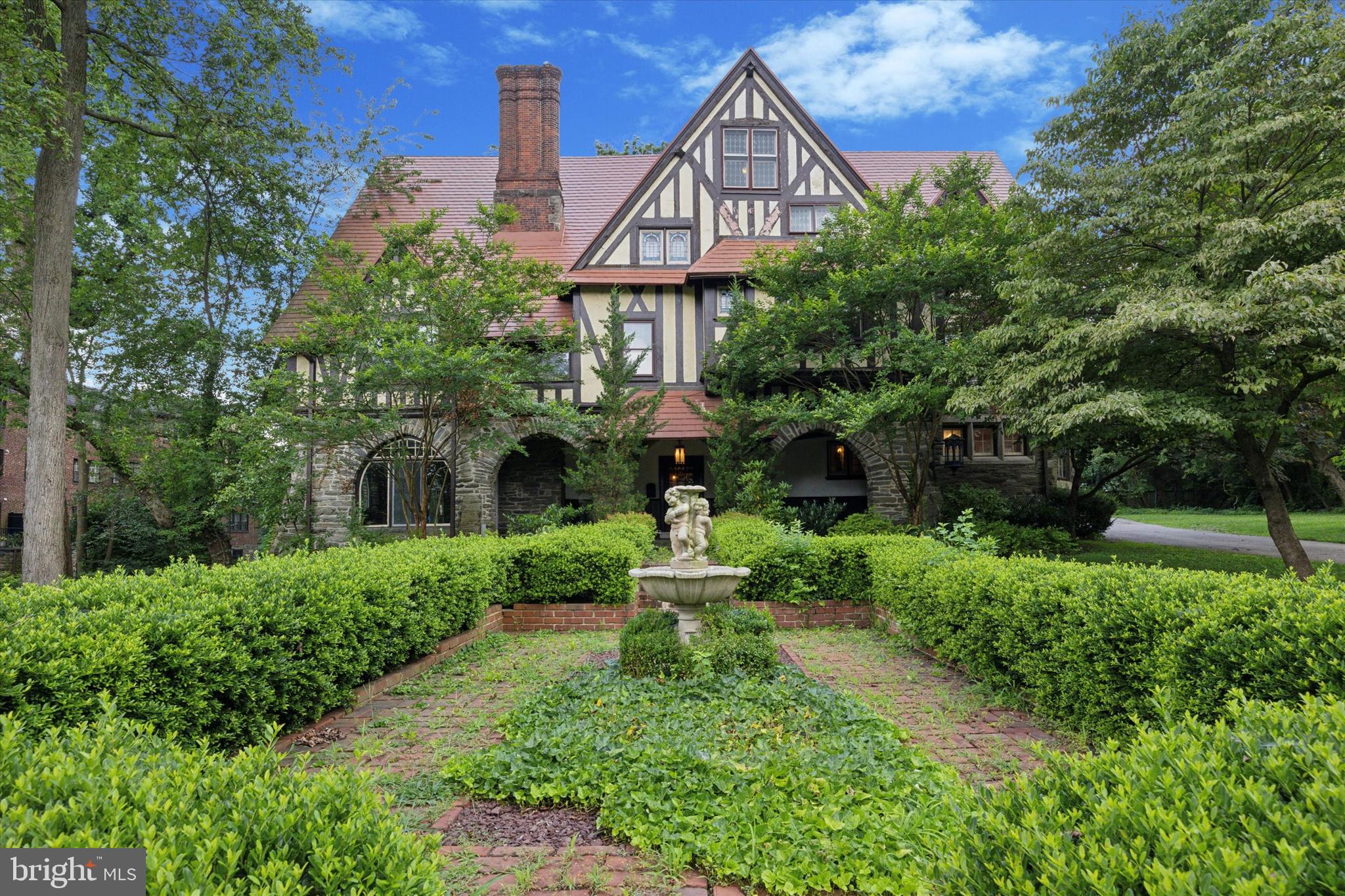 Once in a lifetime opportunity to purchase "Kelty", a majestic Tudor Mansion built by renowned architect William Lightfoot Price. Tucked away down quiet Berwick Rd is this special property that is filled with architectural treasures galore. Incredible details that remain intact including hand carved fireplace mantles, leaded glass windows, stone and plaster archways and unparalleled millwork including wainscoting, moulding, exposed beams, seating and staircases that all have stood the test of time. This is a historical and architectural delight both inside and out but also boasts extraordinary living space (over 8000 sq ft) and a flat, level lot that sits just under an acre of land in beautiful Merion Station. The top floor of this home is incredibly unique with soaring ceilings, a mighty stone fireplace and a long history of musical/play performances with a stage and seating design. This space could function as a magnificent primary suite with the  gorgeous luxury bath attached,  a full built-in bar and a charming walk out Juliet balcony. A detached carriage home sits outside at the end of the driveway with 2 stories of living space and storage/parking. This home has incredible detail inside and out and is ready for its next steward. Located in award winning Lower Merion School District and easy access to Center City, Philadelphia and both the Merion and Overbrook train stations. Make your appointment to see this special property today.
