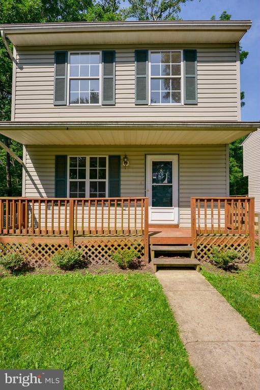 3 br  1.5 bath  colonial in quiet neighborhood backs to woods screened back deck over looking meandering stream  hard wood floors in living room.... community beach  and ramp
