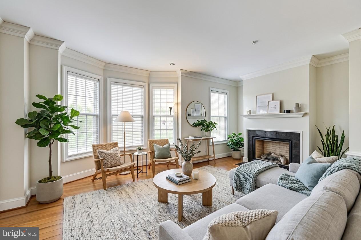 Priced lowest per square foot in National Harbor! This spacious townhouse opens onto a common courtyard just blocks from the Harbor.  Inside, you'll find a light filled foyer with space for your home office, playroom, or additional seating.  Beyond the office is a well sized powder room, coat closet and access to the two car garage with room for two full size cars + additional storage space.  Up the oak staircase with carpeted runner, you'll find yourself on a spacious main level living area - a large living room with fireplace and bay front windows overlooking the courtyard, a gracious kitchen with wood shaker cabinetry, granite countertops, stainless steel appliances and large island with seating for 4.  At the end of the open concept living space, you'll find a capacious dining room with room for a 8+ person table, dining cabinet and more large windows for an inviting light-filled dining area.  The main level has hardwood floors and another powder room for guests.  

The upper two levels have been designed for maximum comfort - all three upper level bedrooms have their own en suite bathroom.  The primary bedroom has double doors to a large suite, including a bedroom area, an ensuite bathroom with jacuzzi tub, shower, and dual vanities, and a large walk-in closet, all overlooking the courtyard below.  The second bedroom has a large bedroom and ensuite full bathroom with a large closet.  In the hallway, the laundry area is tucked behind double doors with plenty of space for additional storage.  On the second upper level, you'll find additional living space - a large family room with wet bar, perfect for entertaining inside or out - with the balcony just off the family room area overlooking the courtyard.  Beyond the family room, the third bedroom boasts a wall of closets and a large en-suite bathroom.  

Located in the Potomac Overlook IV Condo association of the Uplands HOA, this gated community includes all lawn and road maintenance, sidewalk, and road snow removal, trash, and water & sewer.  The community itself has walking paths, common grounds, a dog park, and security.

National Harbor has everything you want in entertainment, dining and shopping, including the National Wheel - a huge Ferris Wheel overlooking the harbor, Escape Rooms, Boat Rides, Bike Rentals, Casino + world class entertainment venue, as well as dining at Bobby McKey's dueling piano bar, McCormick & Schmidt Seafood,Fogo de Chao Brazilian Buffet, Rosa Mexicana, Succotash Southern Cuisine, and shopping at the best of the Tanger Outlets, including Nike, Polo, Michael Kors, J Crew, Underarmer, and Kate Spade.  Relax at Mahagony Books with a Starbucks cold brew or a Boba Tea from Panda Tea House.   

Located just off of 495, National Harbor is a short drive to Downtown Washington DC, Old Town Alexandria, and National Airport.