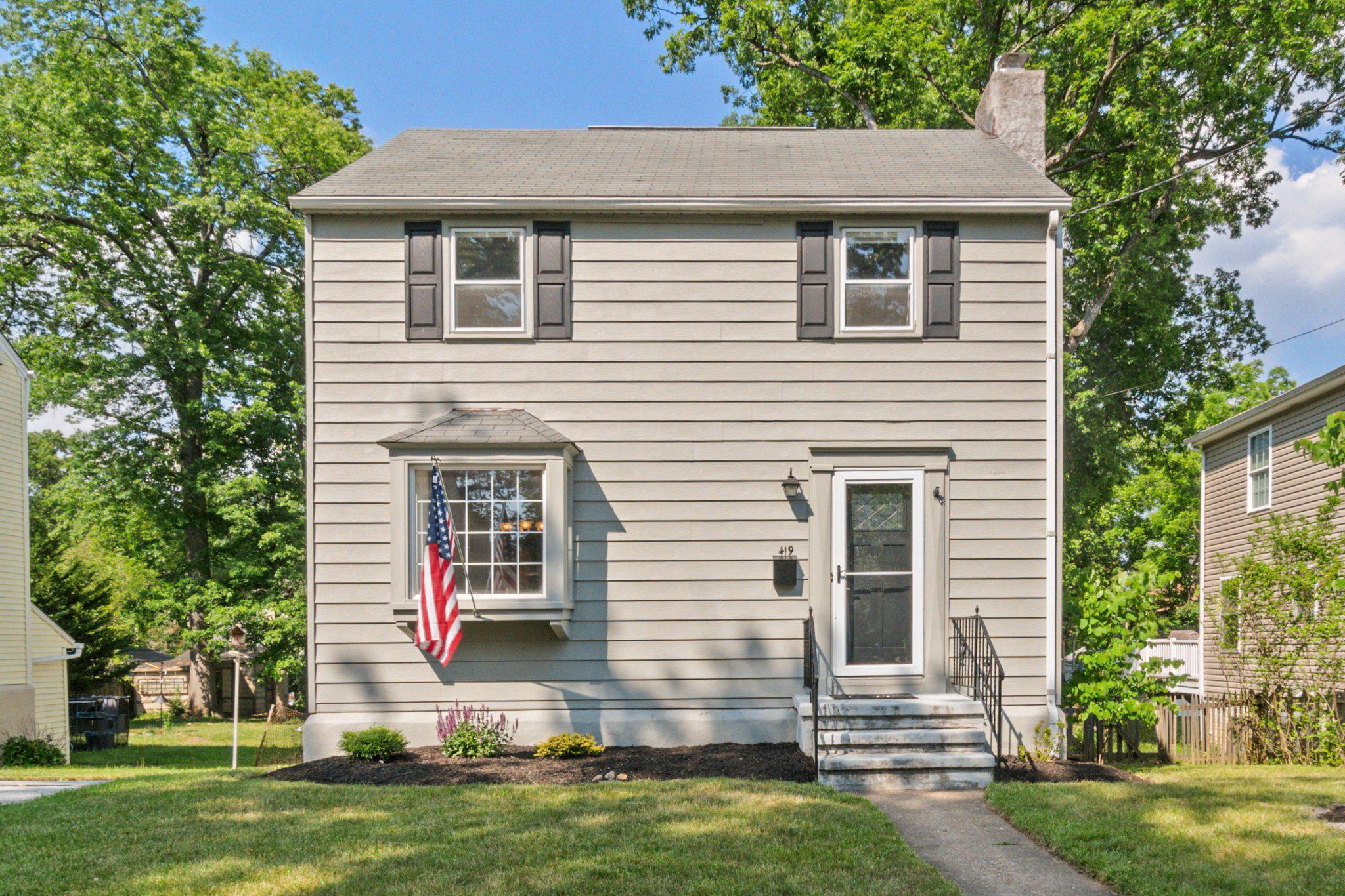 Some houses are just dialed in. Tucked into one of Catonsville's most beloved neighborhoods, this Summit Park charmer sits only a few blocks from downtown but far enough back to feel like a retreat. Convenient to the farmers market, the library, and live music at venues across Catonsville, Maryland's Music City. Be at Patapsco Valley State Park in minutes. Get on I-95 or I-195 without thinking about it.

Inside, the house has real character: hardwood floors, original doors and moldings, and a kitchen that earns a second look. Tin ceiling, custom inlaid floor, and retro style that feels intentional rather than dated. The living room has a gas fireplace insert. The dining room opens wide with a bay window that pulls in the light and a large archway that connects the main living spaces.

Upstairs, three bedrooms and a classic black and white tiled bath. The largest bedroom has a ceiling fan for year-round comfort. Downstairs, bonus living space adds flexibility for a home office, playroom, or hangout space, plus a large utility room with laundry.

Out back, a fully fenced yard with room for a patio, a fire pit, and a garden. Mature trees provide real shade and privacy. The detached one-car garage has workbenches and built-in tool storage, a bonus for anyone who likes to have a project going.

This is the one people are going to kick themselves for sleeping on.