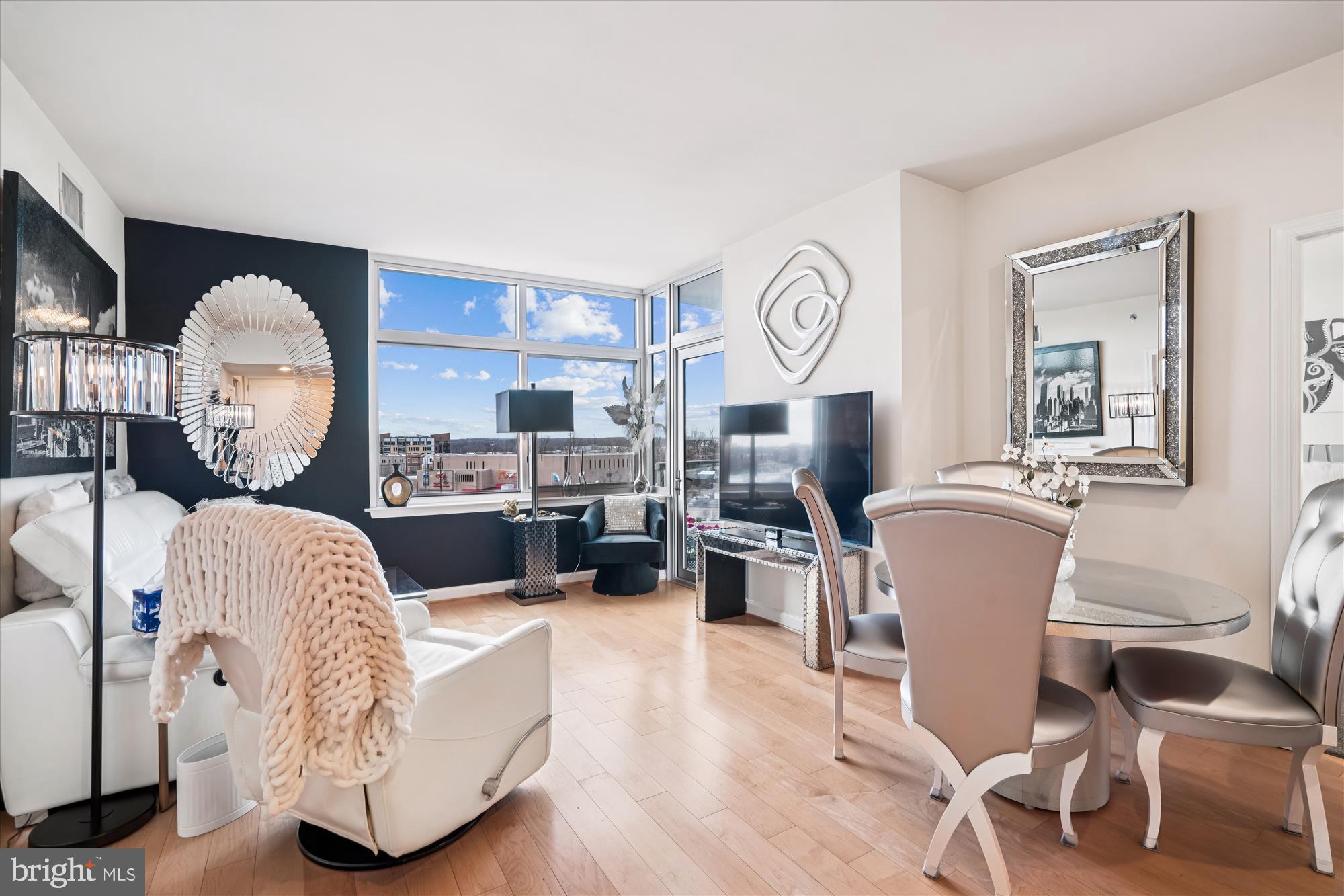 Priced to sell!!  Lowered to 539,000, Don"t miss this opportunity
 Located on the 6th floor of Midtown Bethesda North, this beautiful 2-bedroom, 2-bath condo plus den and private balcony offers more than 1,400 square feet of bright, open living space. The home has been freshly painted throughout and features brand-new hardwood floors, creating a clean, move-in-ready feel.

The open floor plan with 10-foot ceilings and expansive windows fills the space with natural light and beautiful views.  The versatile den is perfect for a home office or additional living space, while the private balcony provides relaxing outdoor space.

Additional features include stainless steel appliances and  granite countertops, custom closets, built-in storage,  a full-size washer and dryer, 2 garage parking spots, and several fobs.  Water and gas are included in the condo fee.

Midtown Bethesda North offers resort-style amenities including a rooftop pool, fitness center, theater room, party lounge, guest suite, and 24-hour concierge. Conveniently located near North Bethesda and Twinbrook Metro, Montrose Crossing, Pike & Rose, and numerous dining, shopping, and grocery options.

Home is now vacant and all furniture has been removed.  The home has been freshly  painted and the  New Wood Floors will absolutely impress you.  Custom cabinet piece is on order...it will look just as the picture does!