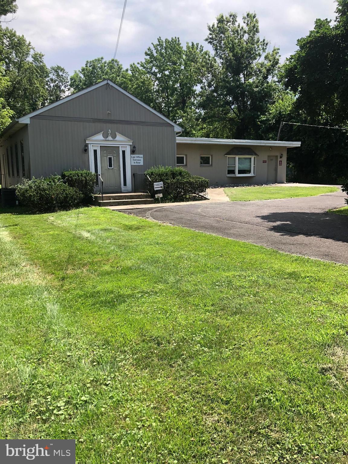 ESTATE SALE - EXECUTOR LOOKING FOR REASONABLE OFFERS! Price just reduced to $699,900.  Now is the time to buy and stop paying rent!
Great opportunity for any professional use or for a commercial use allowed under the zoning.  Turnkey property that is in excellent move in condition and can come furnished if buyer so desires at no additional cost. Previously,  used as a law and psychology office. High traffic location just off traffic light to Parx Casino and very close to Street Road where you are no more than a mile from Route 1, PA turnpike, or I-95.   Just under one acre of ground with large paved parking and separate outside storage facility with potential to expand parking lot behind storage building.  Approximately 2400 sf. building completely renovated consists of reception area, five spacious private offices, conference room, bathroom, kitchen and separate file room.  Central air conditioning.  Low taxes and utilities.  Street signage with excellent visibility.  This is excellent for an aggressive group of professionals who just want to bring their paperwork and computers and immediately start operating without having to worry about furnishing the facility.