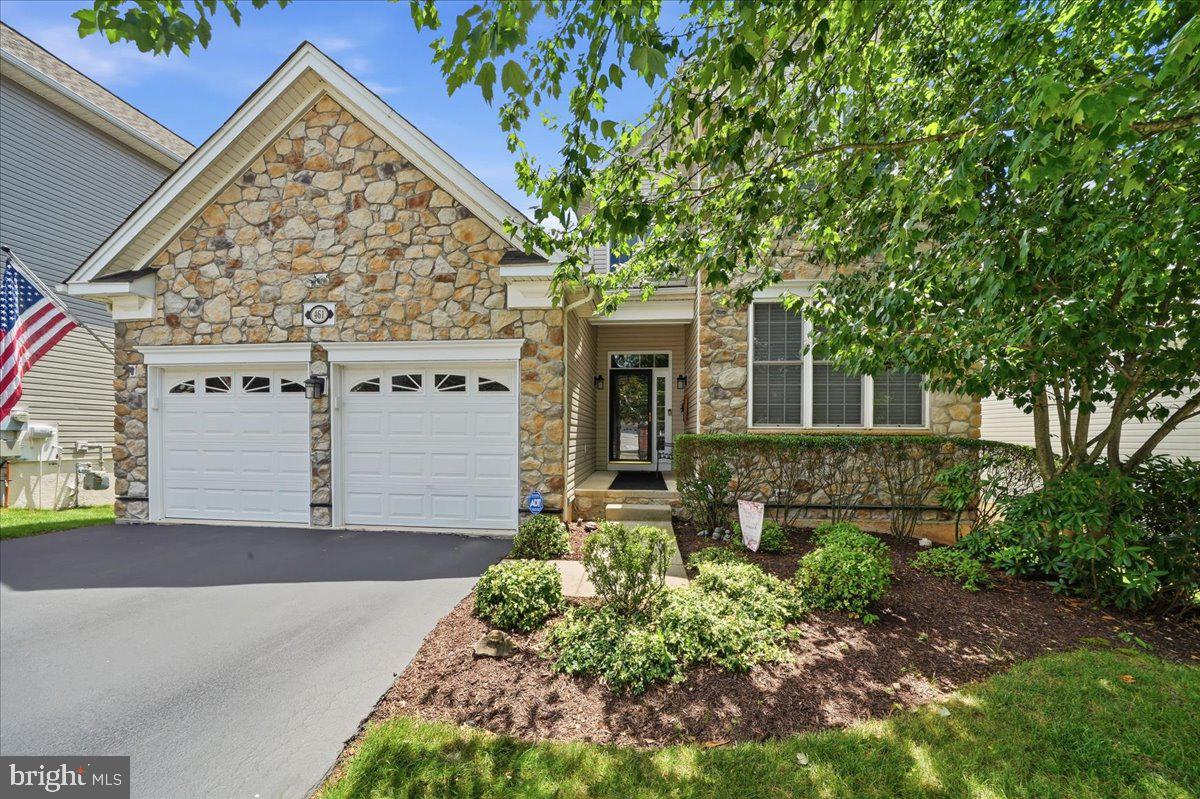 Welcome to 461 Peters Way, an exceptional Walden Manor model in the highly sought-after Regency at Providence, a premier 55+ active adult community. Lovingly maintained by its original owners, this beautifully upgraded three-bedroom, four-bath home combines elegant design, thoughtful upgrades, and generous spaces for everyday living and entertaining. A grand foyer with a dramatic tray ceiling welcomes you into the impressive two-story great room, which was expanded an additional eight feet. A soaring wall of windows fills the home with natural light, while a cozy gas fireplace creates a warm focal point. The extended sunroom, surrounded by windows, offers peaceful views of the professionally landscaped, private backyard. The gourmet kitchen is designed for both functionality and style, featuring upgraded cabinetry, recessed lighting, stainless steel appliances, generous counter space, and a spacious breakfast area perfect for casual dining. Nearby, the formal dining room provides an elegant setting for holiday gatherings and special occasions. Privately situated on the main level, the expansive primary suite features a tray ceiling, oversized windows, and access to the back deck via a sliding glass door. A luxurious en-suite bath features dual vanities, a soaking tub, and a large walk-in shower. The second first-floor bedroom and full bath offer comfortable accommodations for guests, while the convenient laundry room with a newer washer and dryer leads to an oversized two-car garage. Upstairs, a versatile loft overlooks the great room below and serves as an ideal home office, reading nook, or additional living space. A third bedroom, full bathroom, and an oversized walk-in storage closet complete the second level, offering privacy and flexibility for visiting family and friends. The finished walkout lower level is truly an entertainer’s dream. Anchored by a custom U-shaped bar, this expansive space offers multiple seating and recreation areas, a full bathroom, and direct access to the backyard through two walkout doors—perfect for game days, celebrations, or everyday enjoyment. Outdoor living is equally impressive, with an expansive deck featuring a retractable awning overlooking a beautifully landscaped yard designed to maximize privacy and create a peaceful retreat. The house is also equipped with a full generator for peace of mind in storms and power outages. Residents of Regency at Providence enjoy resort-style amenities including two clubhouses, three swimming pools, fitness centers, tennis and pickleball courts, game rooms, social spaces, and an active calendar of community events. Conveniently located just minutes from the vibrant dining, shopping, and entertainment of Phoenixville, the Oaks shopping area, Wegmans, and major commuter routes, this exceptional home offers luxury, comfort, and an unparalleled active adult lifestyle.