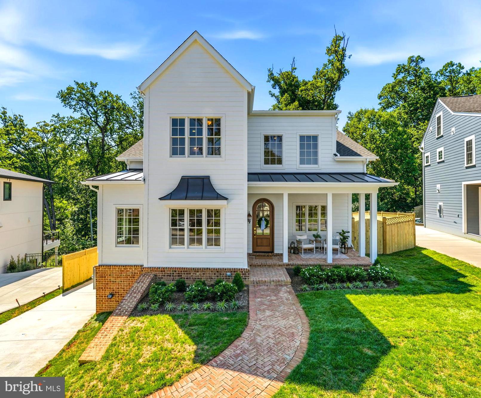 Welcome to a beautifully crafted new construction home nestled in one of Alexandria's most desirable neighborhoods...where timeless character meets modern luxury at every turn. Built by Character Companies Inc., this residence was thoughtfully designed with quality craftsmanship and stylish, curated finishes throughout. This beautiful 7 bedroom, 7.5 bathroom, 6,300sqft+, with 9ft ceiling heights, screened-in porch with curb appeal that turns heads truly sets the tone before you even step through the door. The open-concept main level flows seamlessly between the dining, living, scullery and kitchen spaces — ideal for everyday life and effortless entertaining. Rich 4¾" white oak hardwood floors, two-piece crown molding, and elegant arched openings run throughout. The kitchen is truly the heart of this home with Viatera Soprano Quartz counters, a farmhouse apron sink, a stunning ILVE Italian dual-fuel range with brass burners, panel-ready fridge and dishwasher, and an oversized island with designer pendant lighting — plus a spacious scullery/butler's pantry for extra prep space and storage.  The primary suite is a true retreat: a spa-inspired en-suite bath with a freestanding soaking tub, dual vanities, herringbone marble tile, a frameless glass shower, and a statement chandelier. Three additional bedrooms offer flexibility for family, guests, or a home office — each paired with a beautifully finished, uniquely designed bathroom. Bonus living space throughout: a finished lower level with a private home gym, wet bar, basement bedroom and over-sized full bath, plus a private ADU above the garage — perfect for guests, multigenerational living, or home office. Enjoy abundant natural light, energy-efficient new construction, modern systems for year-round comfort, and inviting outdoor living space perfect for relaxing or entertaining. Unbeatable location: just minutes from Del Ray, Potomac Yard, Old Town Alexandria, National Landing, Reagan National Airport, and Washington, D.C. — with easy access to shopping, dining, parks, Metro, and major commuter routes. This is a rare opportunity to own a newly built home that combines timeless design, high-end craftsmanship, and an unbeatable location. Schedule your private tour today.