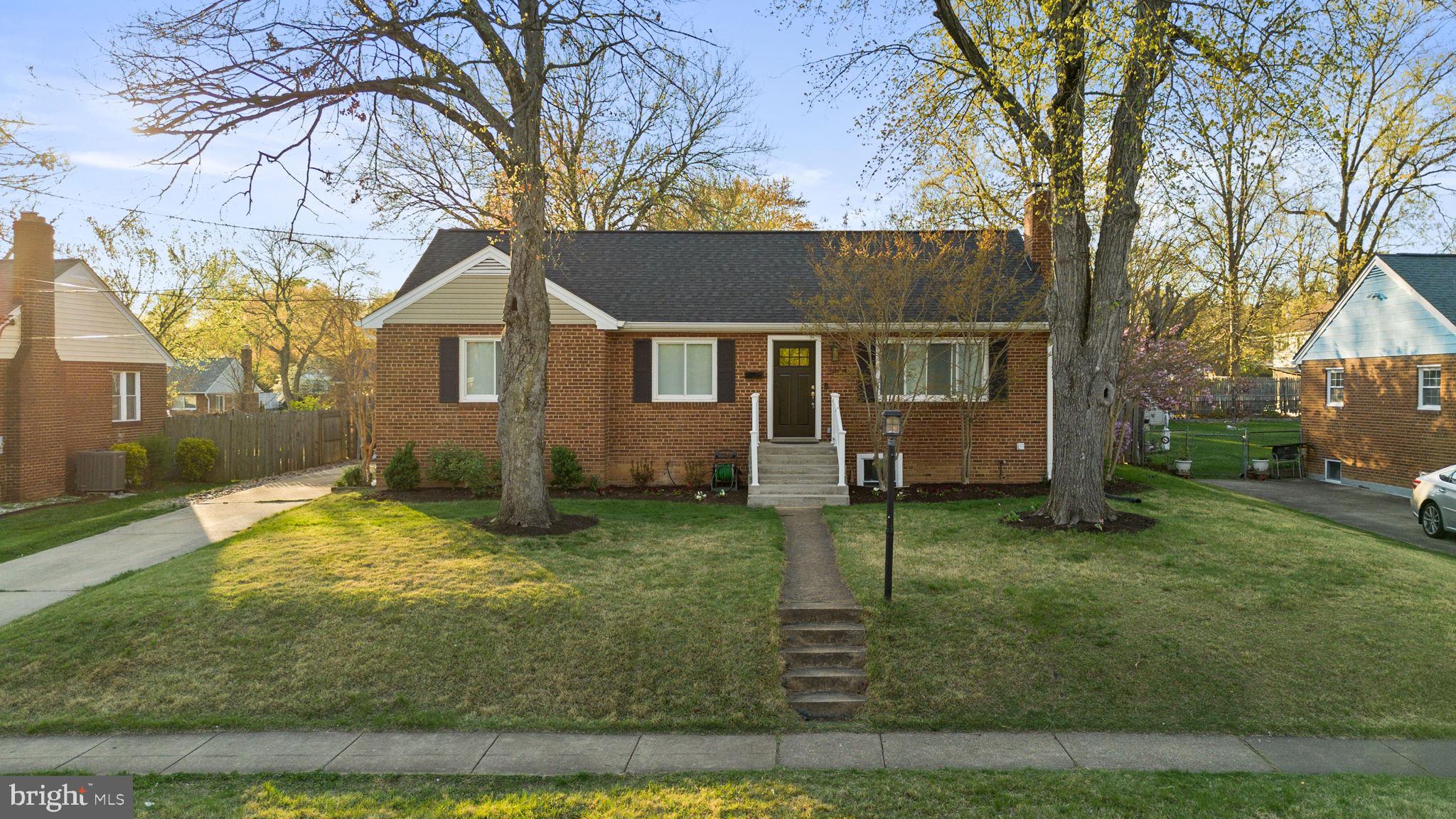 Located in the Parkhaven neighborhood of Falls Church, this light-filled 5-bedroom, 2-bath home sits on a quiet, tree-lined street on a quarter plus acre lot! Conveniently located near the City of Falls Church and major commuter routes including I-395, I-495, Routes 7 and 50, from here you have easy access to parks, shopping, dining, and entertain options. Inside, the living room has a picture window overlooking the front yard and a wood burning fireplace for a warm and inviting gathering space. The dining room is open to the renovated kitchen with white cabinetry, quartz countertops, a tile backsplash, and stainless-steel appliances along with recessed lighting and lovely hardwood floors throughout. A door from the kitchen provides access to the back deck and expansive yard for relaxing and play,hot tub conveys! Three bedrooms and an updated full bath are on the main level while fixed stairs to the floored attic provides additional storage and loads of potential. Downstairs, the fully finished lower level offers exceptional flexibility with a family room, two bedrooms (both with egress windows), a full bath, and a full kitchen, along with a private rear outside entrance making this home well-suited for an au-pair or in-law suite, or potential rental use. Welcome home!