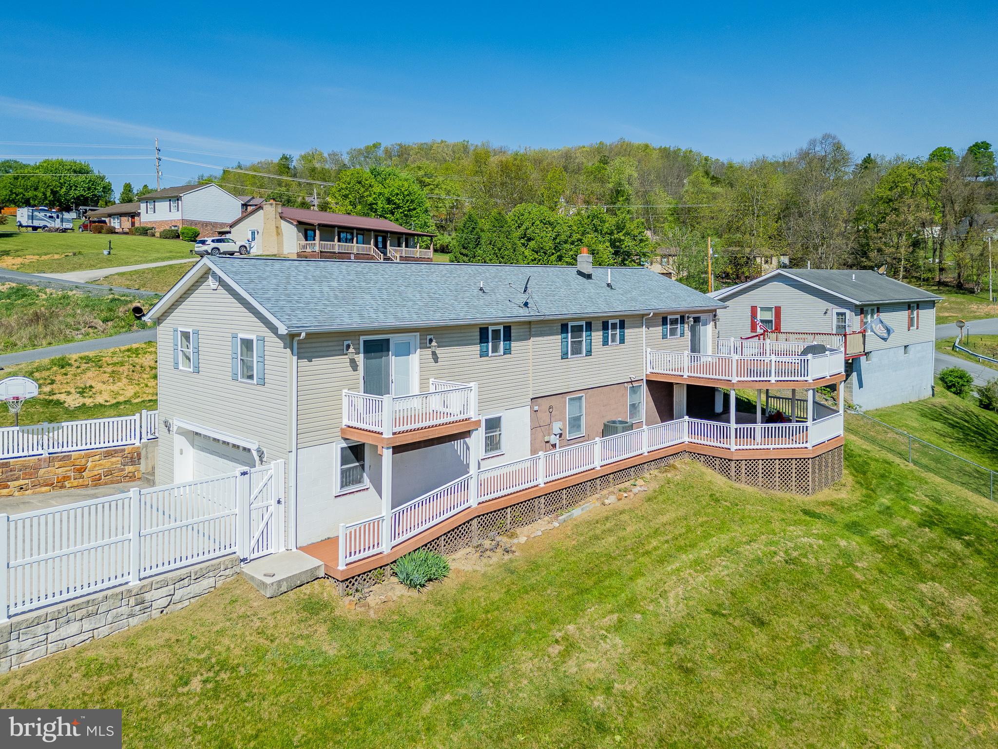 This is the one! Welcome to this stunning 4-bedroom, 3-bath ranch-style home perched atop a hill overlooking the scenic town of Franklin. Meticulously maintained, this property offers the perfect blend of rustic charm and modern comfort, ideal for both families and those seeking a peaceful retreat.
Inside, you’ll find a versatile layout featuring three bedrooms with private en-suite baths, while the fourth bedroom offers flexibility as a guest room or home office. The kitchen is designed to impress with granite countertops, abundant cabinetry with under-cabinet lighting, and direct access to a spacious rear deck—perfect for outdoor dining and entertaining while taking in the panoramic views.
The owner’s suite is generously sized and features a private bath along with exclusive access to its own deck, creating a quiet space to unwind. The home offers convenient entry from the main level or through the lower level, where you’ll find an oversized garage ideal for vehicles, storage, or recreational equipment.
Outdoor living is a standout feature with double-level Trex composite decks, providing low-maintenance enjoyment year-round. Numerous recent upgrades add value and peace of mind, including a new heat pump and central air system (2024), new drywall in the garage, interior paint, whole-house water filtration system, new basement door, and a brand-new shingle roof installed in 2026 with a transferable warranty.
Additional highlights include a backup propane/electric furnace, a cozy propane fireplace in the basement den, and all smart TVs conveying with the sale.
Offering space, updates, and breathtaking views, this home delivers the perfect combination of comfort and functionality. Priced to sell—don’t miss your opportunity. Call today to schedule your private showing.