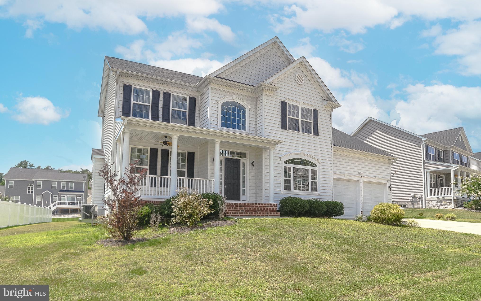 No need to wait for new construction...beautiful 5-bedroom home with all the upgrades.  Huge kitchen with upgraded cabinets, appliances and counter tops as well as a contrasting grey island.  Just off the kitchen is the spacious eating area that opens up to a large great room with stone faced fireplace.  Go from there to the screened in 12X12 porch which is perfect for outdoor entertaining no matter the elements.  Oversized owner's suite with multiple closets and beautiful bath complete with a custom walk-in shower.  Make your way into the finished basement which has another bedroom and full bath and wet bar.  Basement is wired for surround sound and projector which is all routed to the closet for easy access.  You will be in love at first sight!