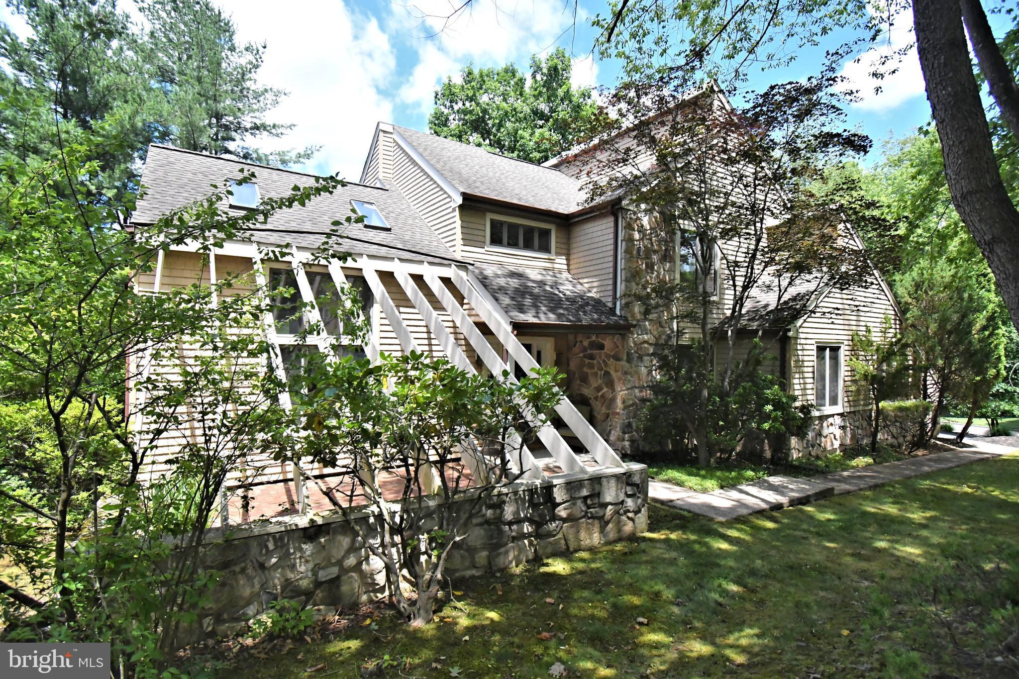 Welcome to this exceptional contemporary home in the highly sought-after Wychwood Glen community, where homes are rarely available. Perfectly positioned on a quiet circle drive and directly adjacent to Core Creek Park, this beautifully treed property offers a peaceful, park-like setting while remaining close to major transportation routes, shopping, dining, and top-rated schools.

Offering approximately 2,900 square feet of living space, this home features 4 bedrooms, 3.5 bathrooms, soaring ceilings, and an open, flowing floor plan designed for comfortable everyday living and effortless entertaining. The spacious family room, highlighted by a propane fireplace, opens to the breakfast area and leads to a new multi-tiered deck overlooking the picturesque backyard.

Step outside to your own private retreat where mature trees surround multiple patios, creating the perfect space to relax or entertain. The ultra-convenient outdoor kitchen with built-in grill makes hosting family and friends a breeze while you enjoy the tranquil surroundings.

The versatile first-floor library/office can easily serve as a guest room or potential fifth bedroom. The finished walk-out lower level is thoughtfully designed as an ideal in-law or guest suite, complete with a large recreation and sitting area, wet bar, full bathroom, and sliding glass doors leading directly to the patio and backyard.

The primary suite is a true owner's retreat, featuring a designer walk-in closet, whirlpool soaking tub, separate shower, and generous closet space. Three additional bedrooms are served by a convenient Jack-and-Jill bathroom layout.

Extensively updated inside and out, this home combines quality improvements, exceptional indoor and outdoor living spaces, and one of the area's most desirable locations. With direct access to the beauty and recreation of Core Creek Park and the rarity of available homes in Wychwood Glen, this is a unique opportunity to own a truly special property.