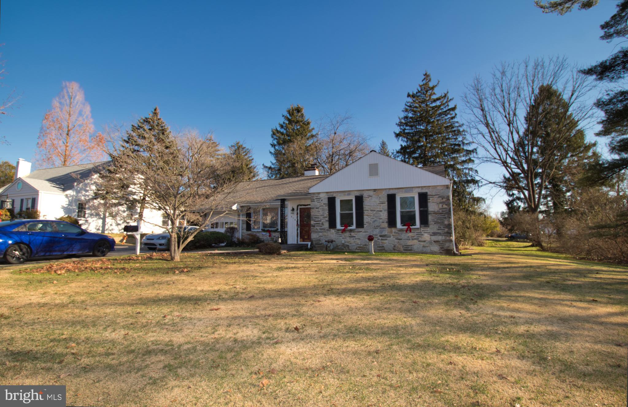 Stone and Vinyl corner Ranch home in Flourtown.  Features 4 bedrooms, full bath, powder room,  Living room with wood burning fireplace,  formal Dining Room, eat in kitchen with double sink and electric stove.  Laundry room with a door to the covered back patio.   Pull down stairs to the floored attic for storage.  Master bedroom with hardwood floors.  Three other nice size bedrooms, which one is being used as a Den.  New roof with replaced wood in 2016.