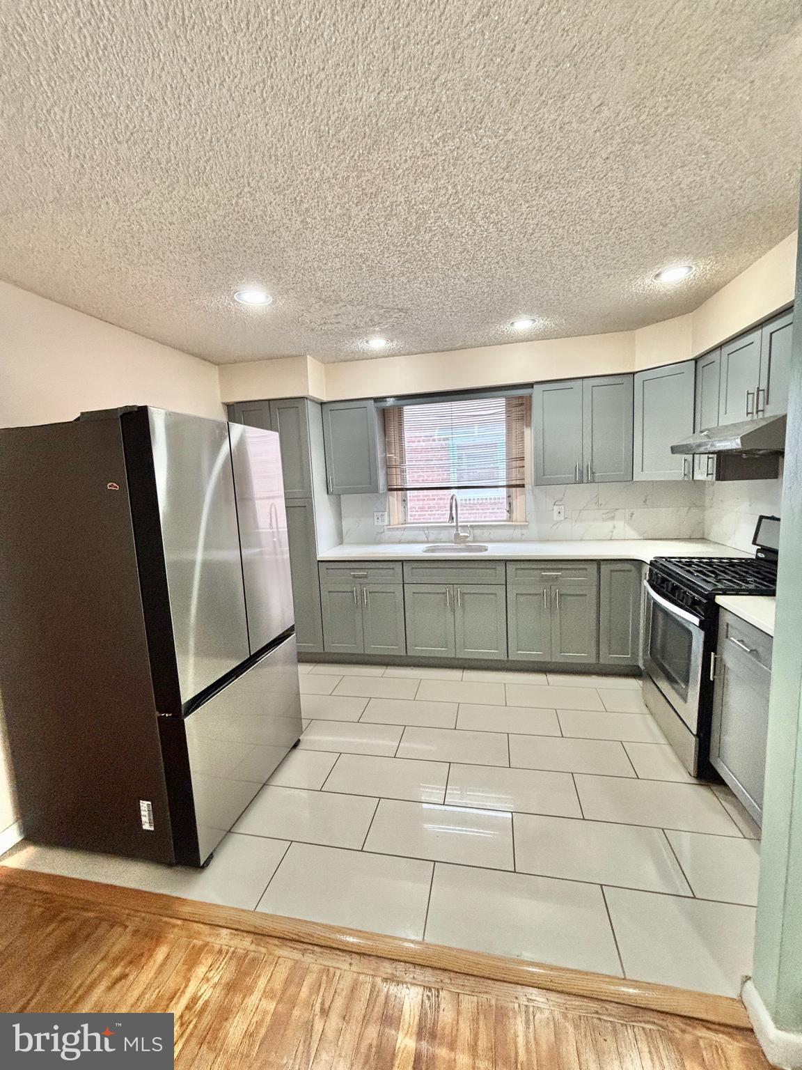 OPEN HOUSE THIS SATURDAY 4/11 FROM 11:00 TO 1:00PM

Step into luxury living at its finest in this beautifully renovated 4-bedroom, 3-bathroom twin home, perfectly situated in the desirable Rhawnhurst, Bells Corner neighborhood. This unique multi-level property offers a spacious open floor plan, thoughtfully designed for both comfort and style.

Flooded with natural light from a large front window, the main level features a bright and airy living room that flows seamlessly into the dining area and modern kitchen—complete with gleaming hardwood floors throughout. A custom staircase serves as a striking centerpiece, adding character and elegance to the home.

Just a few steps down, you’ll find a generously sized family room with durable ceramic flooring—perfect for relaxing or entertaining. The upper levels offer four well-proportioned bedrooms and three full bathrooms, providing ample space for family, guests, or a home office setup.

Meticulously maintained and freshly updated inside and out, this move-in-ready home is nestled in a warm and welcoming neighborhood. Enjoy the convenience of being within walking distance to shopping, public transportation, and Pennypack Park—ideal for walking, biking, and outdoor activities.

With easy access to major roads, transit hubs, and nearby medical facilities, this home truly combines comfort, convenience, and style.

Schedule your showing today—this exceptional home won’t last!