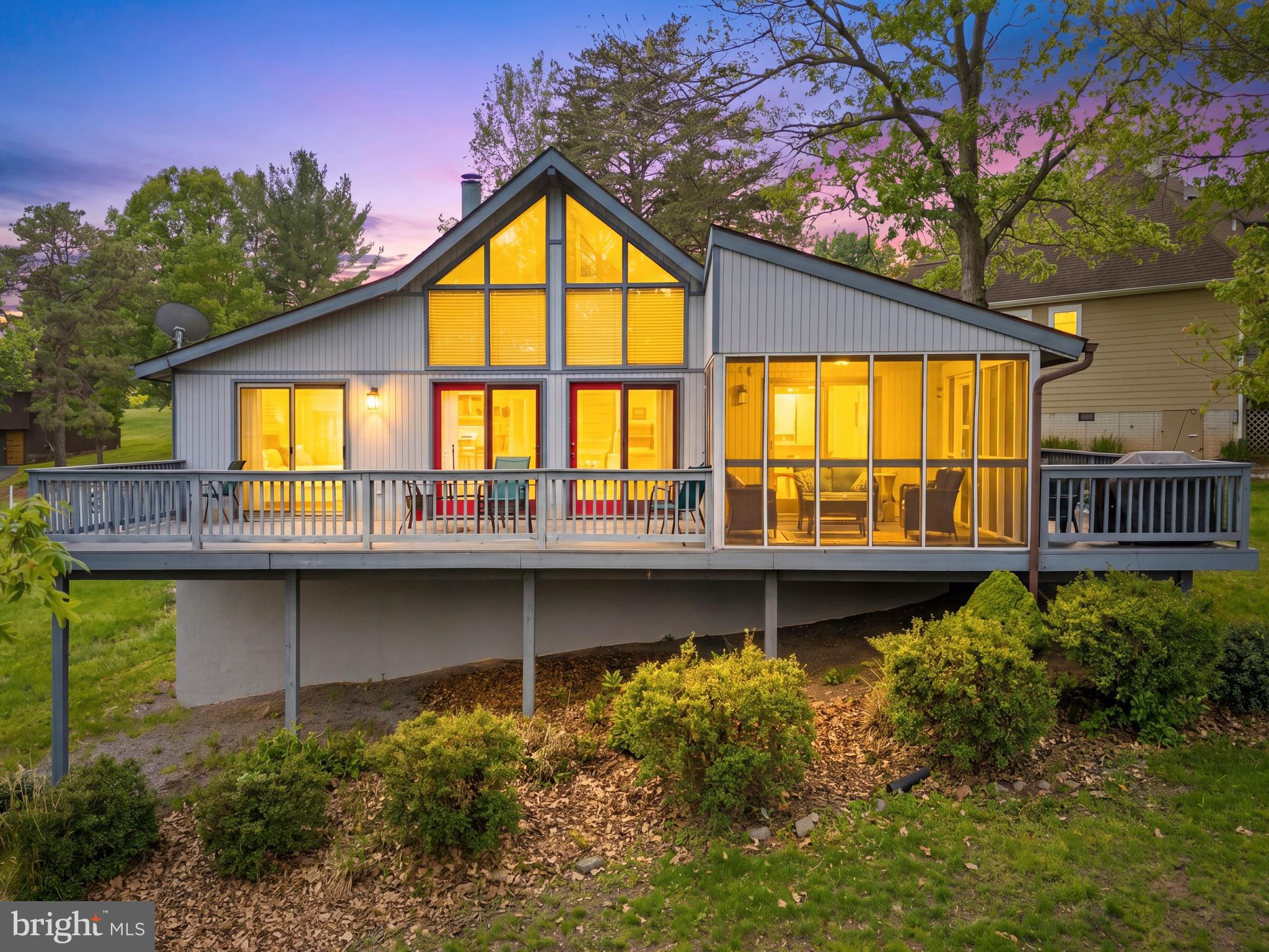 Welcome home to Serenity in The Woods Resort! This beautifully updated 3-bedroom, 2-bath chalet offers approximately 1,686 square feet of inviting living space with breathtaking views overlooking the 18th fairway. From the screened-in porch to the expansive wraparound deck, every space is designed to relax and enjoy the peaceful resort setting.

Inside, you’ll find a bright, open floor plan filled with natural light from the dramatic wall of windows. The main level features brand-new carpet and luxury vinyl plank flooring throughout, including the kitchen and bathrooms. The spacious chef’s kitchen includes stainless steel appliances and a large seating area perfect for gathering with family and friends.

The owner’s suite offers a private retreat with dual vanities and a large walk-in shower featuring a built-in corner seat. Fresh exterior paint adds to the home’s warm and welcoming curb appeal.

Currently used as a successful short-term rental, this property offers excellent potential as a vacation getaway, investment opportunity, or full-time residence.