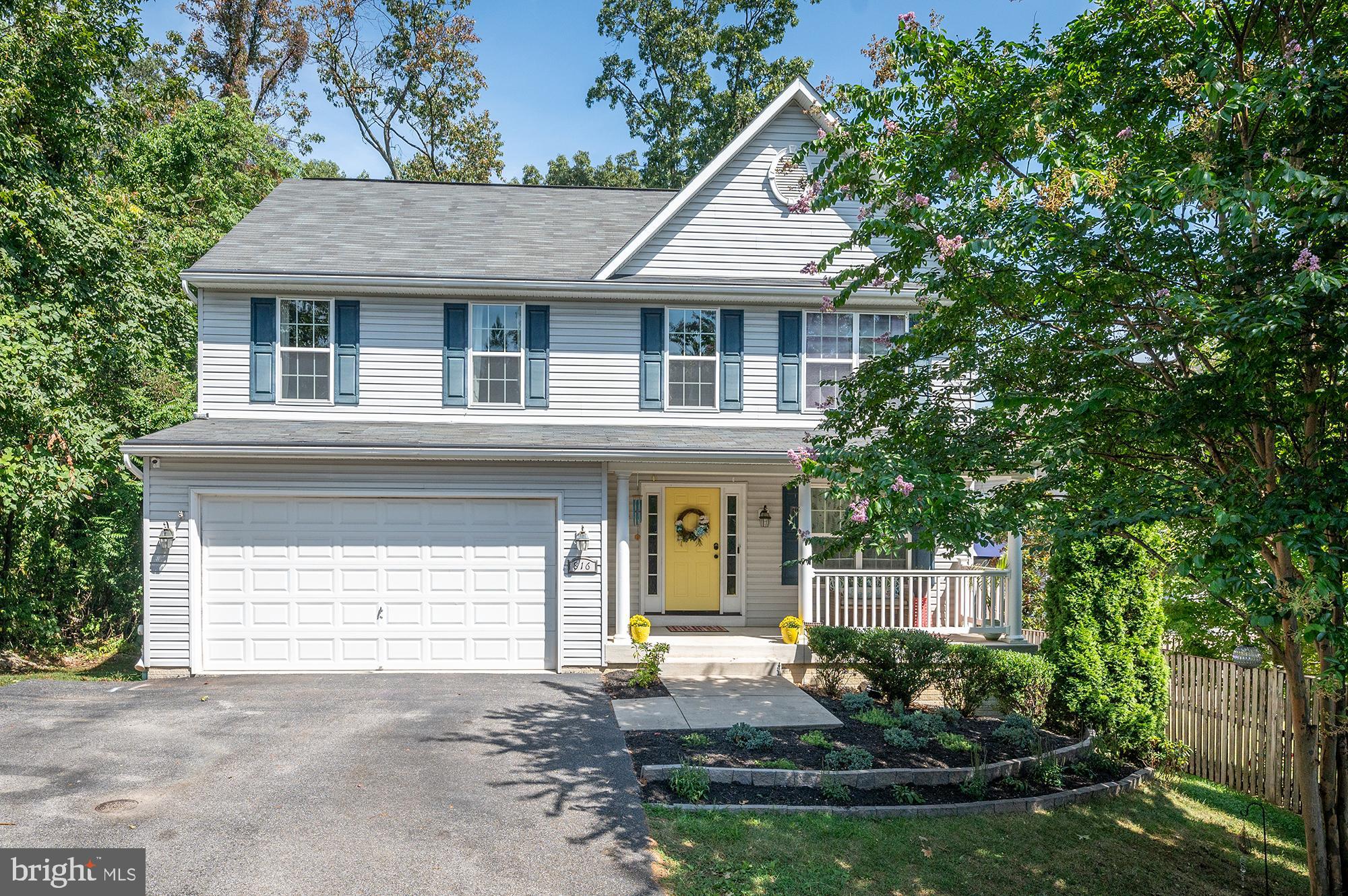 This beautiful home has all you're looking for. With almost 3900sf of finished space, there's plenty of room for all your needs and lots of upgrades. The main floor has everything,  a large welcoming foyer off the covered front porch opens to the sitting room. There is a half bath off the kitchen/living  room which extends the entire width of the rear of the house, and you can also access the large two car garage.  The kitchen/living opens to an oversized deck for dining & grilling, and a large fenced in backyard that is nicely landscaped with a large paver patio, mature trees, and swing set.  A large primary bedroom with ensuite bath and three good size bedrooms serviced by a full bath make up the top level, and  the Washer and Dryer are on this level.  The lower level includes a wet bar,  half bath and  access to the backyard. This home is in great shape and has been very well cared for. Great Location near Rt 97, Rt 100, Ft. Meade, NSA, BWI, Homeland Security.