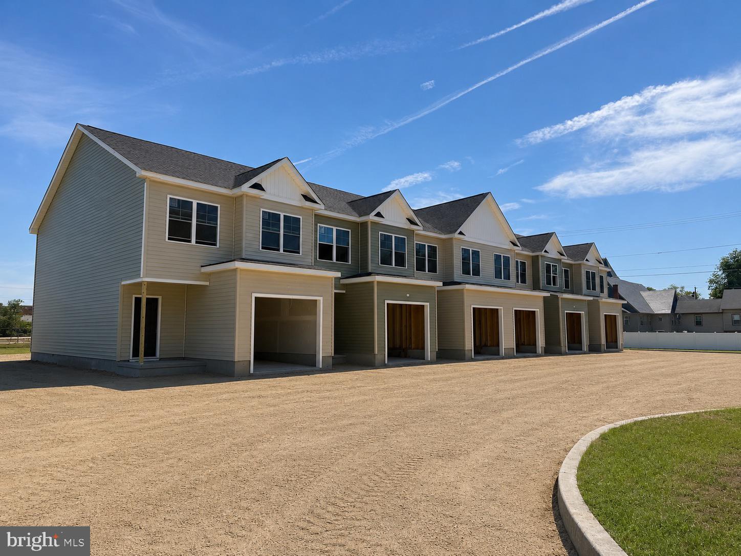 BUYER ONLY NEEDS TO QUALIFY FOR $275,000 - NOT LIST PRICE OF $325,000. Welcome to the newest, most premier luxury townhomes in Pocomoke! Expected to be finished in May, these homes are sure to wow! The main living level features an open-concept layout with a spacious living area that flows directly into the kitchen and dining space, creating a functional and comfortable setting for everyday living. The kitchen is designed with both style and practicality in mind, offering ample cabinetry, generous counter space and premium fixtures. Upper levels include well-proportioned bedrooms, including a primary suite with a private en-suite bath and dual walk in closets. Two additional bedrooms are located on the second floor. Bathrooms feature modern fixtures and are located on both floors. The lower level provides valuable additional space with direct access to the attached garage, offering convenience and extra storage. Select units include outdoor living options such as a rear deck or balcony. Located in the Drawbridge Villas community in Pocomoke City, the property is close to local amenities, services, and major routes. Eligible buyers may qualify for the Pocomoke Uplift Grant Program, allowing the opportunity to purchase a home valued at $325,000 for $275,000. A rare opportunity to own a brand-new townhome with modern features, practical layout, and exceptional value. Whether you are a first time buyer or looking to make a sound future investment, this property is calling your name!