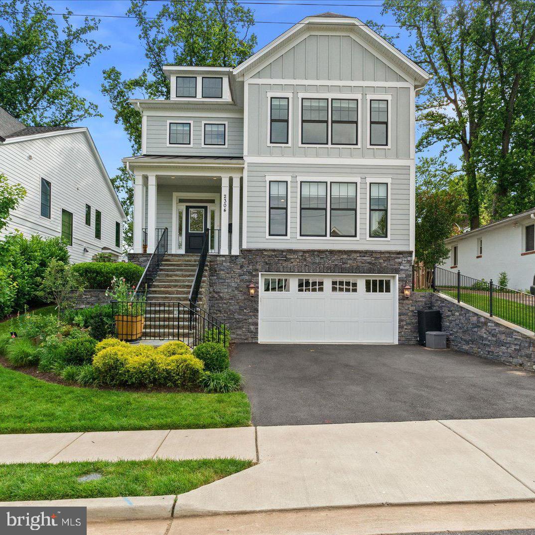 SUNDAY OPEN CANCELED - Under Contract!  Why wait for new when you can have next to new and move right in?  Built new in 2020 by Evergreene Homes, 2304 N. Kensington is ideally located in the heart of the Tuckahoe Village neighborhood and checks all of the boxes.  This six-bedroom, six full bathroom home offers nearly 5,000 finished square feet of luxurious living space with an ideal layout for today’s living.  Enter the open concept main level and be greeted by gleaming wide plank hardwood floors that flow throughout.  A main level front living room is also a legal seventh bedroom or could be an ideal home office or separate playroom with a large closet, built-in shelving and access to full hall bathroom.  A spacious dining room that is dinner party ready is open to a wonderful main level family room with gas fireplace.  The chef’s caliber kitchen is what every homeowner is looking for.  With a generous amount of cabinetry, oodles of quartz countertops, professional grade stainless appliances, a convenient center island and large separate pantry, would-be culinary artists will never want to leave.  Off the family room is a large rear deck, ideal for outdoor entertaining, overlooking the flat, fully fenced rear yard.  
The second level is home to four spacious bedrooms, including a king-sized primary suite, with two walk-in closets and a spa-like primary bath with soaking tub, dual vanities, a separate water closet and a large marble shower.  Two bedrooms share a jack-and-jill bathroom while the third bedroom has a large walk-closet and full en-suite bath.  A deep laundry room with excellent storage completes this level.
The third level has a landing office area and a large bedroom with en-suite full bath, while the lower level is home to an expansive family room and recreation space, a wood shop, the home’s sixth bedroom and sixth full bathroom and the attached two car garage, complete with electric car charger.  
This elevator-ready home to all four floors also features custom blinds on nearly every window of the house, two zoned heating and cooling and is only 1.5 miles to the East Falls Church Metro.  Nearby shopping and amazing dining options, along with close proximity to Ballston Quarter, The Pentagon, Marymount University and downtown D.C. truly put 2304 N. Kensington in the center of it all.  Welcome home!