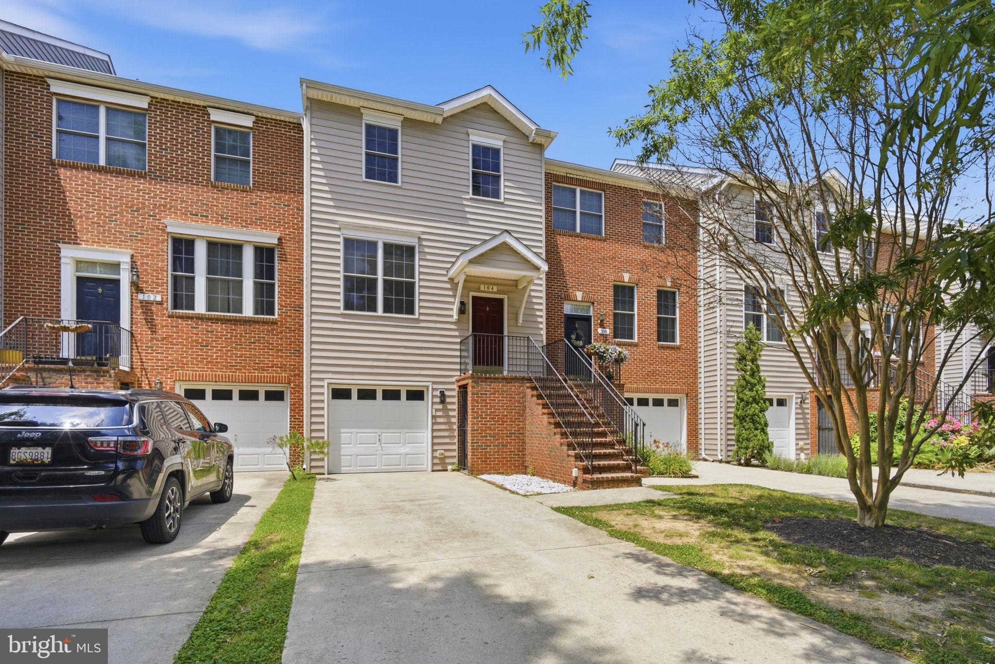 Welcome to this three-level, interior-unit townhome in the desirable Oak Hollow community of Chestertown. Conveniently located near shopping, schools, the YMCA, and historic downtown, this home offers comfortable living and low-maintenance convenience. The entry level features a one-car garage and a flexible bonus room ideal for a home office, gym, or recreation space with walk-out access to the rear yard. The main level includes a spacious living room, half bath, and an eat-in kitchen with pantry storage and adjoining dining area. Step outside to the rear deck overlooking a peaceful wooded backdrop. The upper level offers three bedrooms, including a primary suite with a private bath, plus a full hall bath and conveniently located laundry area. Whether you're a first-time homebuyer, looking to downsize, or seeking an investment property, this Oak Hollow townhome is ready for its next owner.