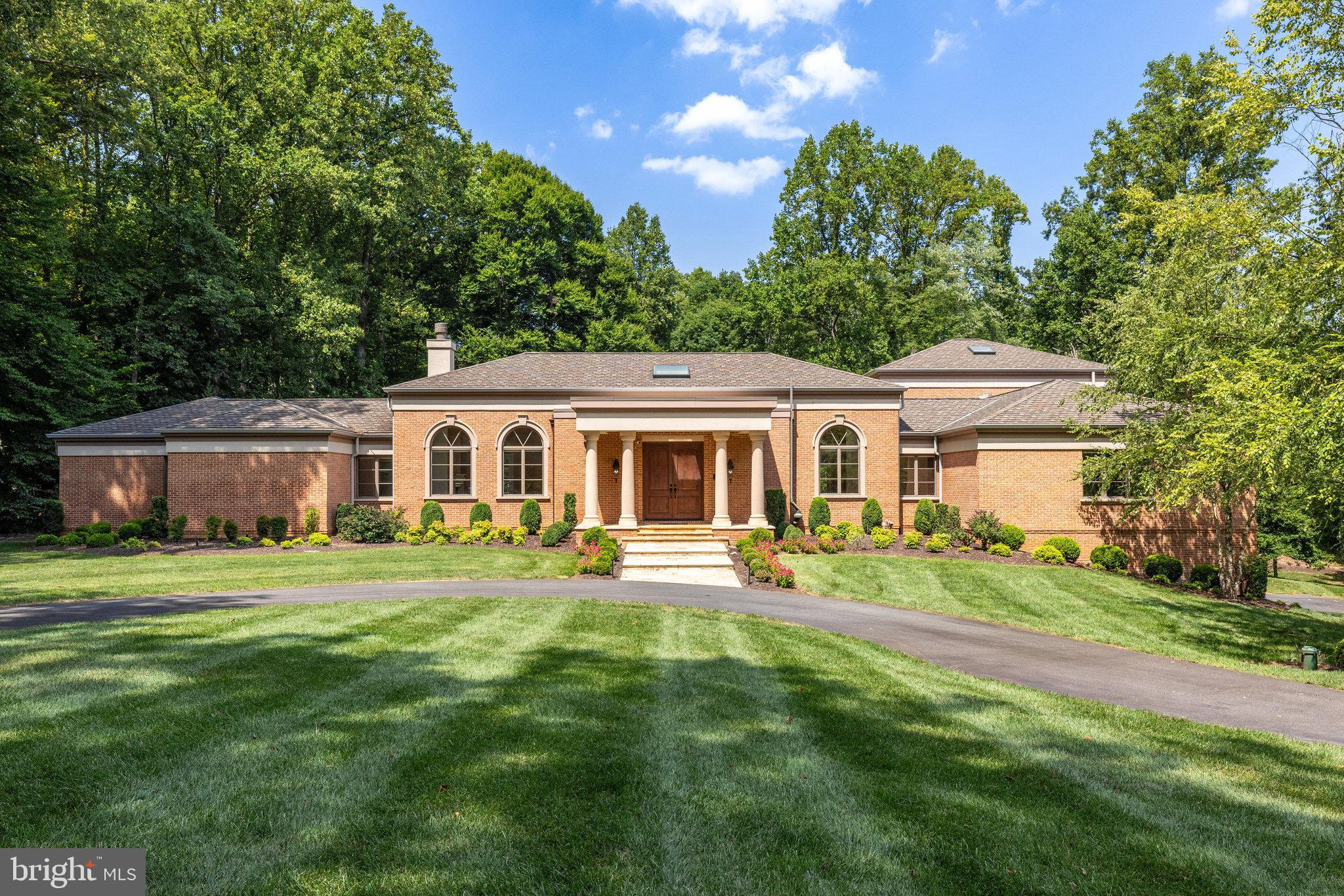 Elegant Custom-Built Home with modern renovations on 2.24 acres. Welcome to this gorgeous, completely renovated custom-built home offering 6 bedrooms and 4 ½ bathrooms, sited on over two stunning acres of private, secluded land. This exquisite residence features 12-foot ceilings and French doors throughout, creating an airy and elegant atmosphere. The gourmet kitchen is equipped with quartz countertops, a large island, a Thermador appliance suite, and a subway tile backsplash, making it perfect for both everyday cooking and entertaining. Embassy-size rooms provide ample space for hosting large gatherings. Two ensuite bedrooms are conveniently located on the main floor, offering comfort and privacy. The luxurious owner’s suite is a true retreat with three walk-in closets all with custom shelving, private access to the veranda, and a spa-like bathroom. Additional features of this home include hardwood floors on the upper level and most of the main level, two elegant fireplaces, new lighting throughout, and an elevator to all 3 levels. 2922 sq ft of unfinished space offers potential for a media room, wine cellar, and more. Enjoy stunning vistas from every room in the house. The exterior of the property is equally impressive with a welcoming circular driveway for visitors and a separate drive leading to the oversized 3-car garage with car lift. The massive stone veranda spans the entire back of the house and is accessible through multiple arched French doors. Outdoor amenities include a hot tub area with maintenance-free decking, a separate lower patio with a built-in grill and mini fridge, and beautifully landscaped, private grounds. Experience the perfect blend of luxury, comfort, and privacy in this extraordinary home. Schedule a showing today and discover all the exceptional features this property has to offer.