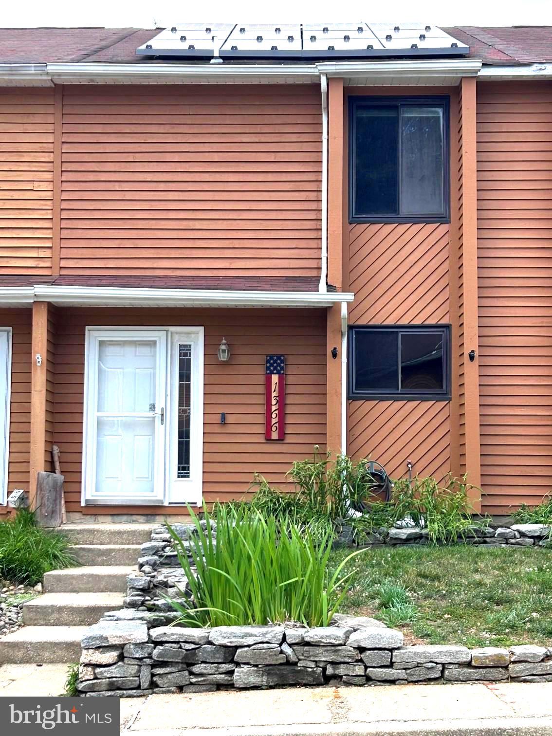 Welcome home to this well-maintained 3-bedroom interior townhome featuring reserved parking and stylish upgrades. The spacious main level offers a kitchen equipped with stainless steel appliances and beautiful granite countertops, combining functionality with modern appeal, a convenient half bath, dining room and  a living room with crown molding,  sliding glass door leading to a private fenced backyard—perfect for relaxing or entertaining. Upstairs, you'll find three bedrooms and a full bath with dual access from both the primary bedroom and the hallway, providing convenience and privacy. Additional storage is available with pull-down attic stairs for easy access.This inviting home offers a great blend of comfort, style, and practicality in a desirable townhome setting.