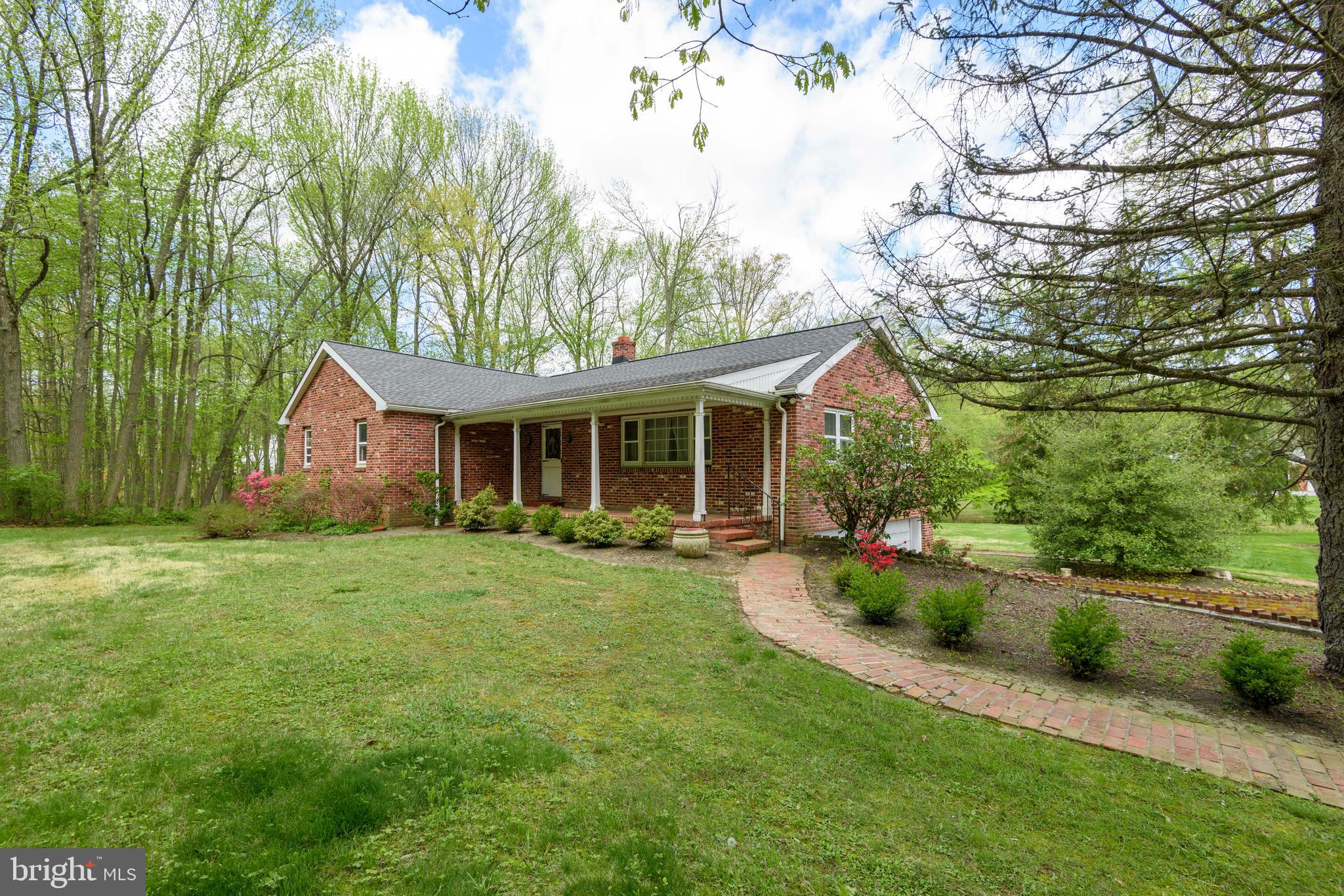 TWO PARCELS: 
A wonderful opportunity awaits with this unique property offering a home, barn, and two separate parcels with endless potential in the highly acclaimed Garnet Valley School District.
Set against a picturesque backdrop, the property backs to a peaceful stream, creating a serene and private setting. The residence is a charming brick raised ranch brimming with character and ready for your personal touch. A welcoming front porch leads into a classic center hall layout, where a spacious living room is highlighted by a triple window that fills the space with natural light. The eat-in kitchen features oak cabinetry, stainless steel appliances, and a generous pantry, flowing seamlessly into a bright rear sunroom perfect for morning coffee or casual entertaining. A formal dining room provides additional space for gatherings and everyday living. The home offers four bedrooms and two full baths, including an owner’s suite with a large walk-in closet and en-suite bath w/ shower. Partial basement, built-in two-car garage,
The adjoining parcel, included in the sale, features a two-story barn equipped with electricity and a wood stove, ideal for hobbyists, storage, or potential adaptive use. Buyers are encouraged to verify with the township regarding possibilities for new construction on this lot.
Important Information: The neighboring driveway appears to encroach on the adjoining parcel, and an electrical easement services the home to the rear (meter located on the barn). Buyer will be responsible for obtaining Use & Occupancy certification and complying with any applicable township requirements.
This versatile property presents a unique opportunity to create something truly special in a prime location bring your vision and unlock its full potential.