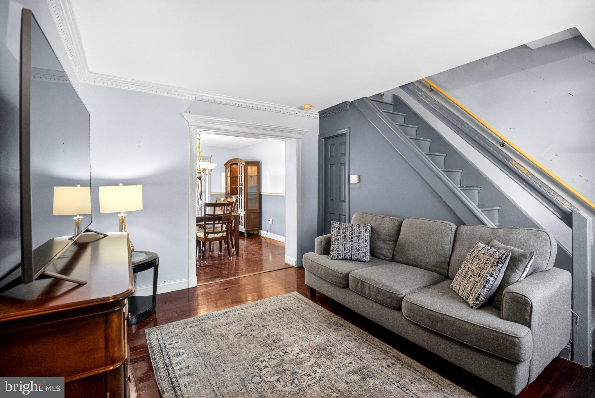 Nice new listing on a wide, tree-lined Pennsport block, just a stone’s throw from Queen Village. Welcome to 1119 E Moyamensing Avenue, a three-story, three-bedroom, one-bath home spanning approximately 65 feet deep, filled with natural light, hardwood floors, and a massive, private outdoor space, a rare find.
Enter into a bright living room with hardwood floors that flow seamlessly into a sizable dining area with side windows. The space opens to an expansive kitchen featuring abundant cabinetry, custom built-ins, granite countertops, designer tile backsplash, and stainless steel appliances. Large double doors lead to a fabulous oversized yard with a side breezeway, ideal for entertaining or relaxing.
The second floor offers straight stairs to a hall landing with a window, a front bedroom, full tiled bath, convenient hall laundry, and a rear bedroom with windows on multiple exposures providing excellent natural light.
The third floor features a spacious bedroom with built-ins and access to the roof, perfect opportunity for a future roof deck with some nice, open and airy views.
Full basement for mechanicals and storage.
Property offers solid space and potential but is ready for updating.

A great block and great location, walking distance to everything Queen Village and Pennsport have to offer including restaurants, cafes, parks, and playgrounds. Schedule your showing today!
