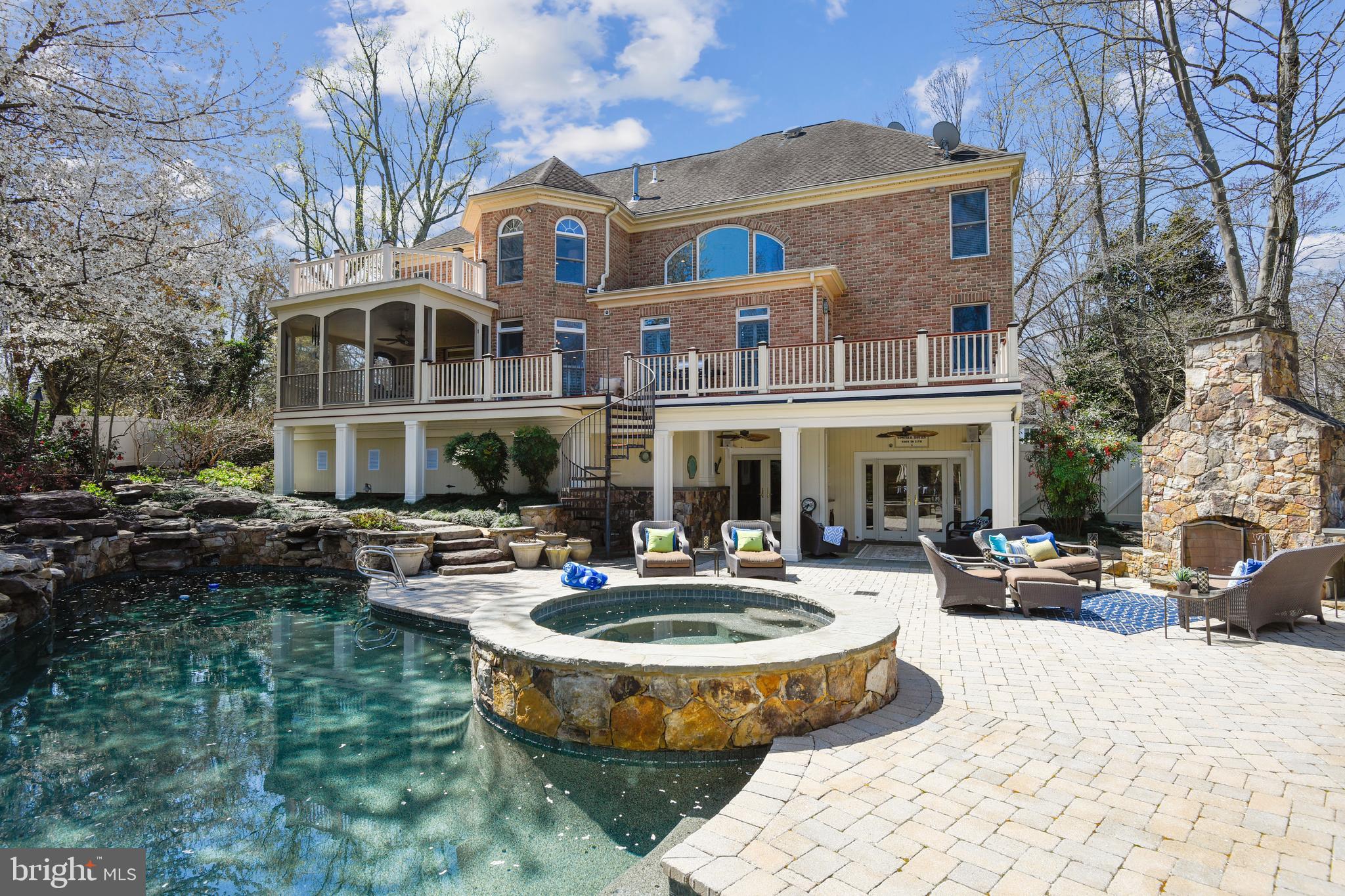 STUNNING ALL BRICK 6300+SF HOME WITH HEATED INGROUND POOL | SPA |  OUTDOOR ENTERTAINMENT CENTER AND SHARED DEEPWATER PIER (7'MLW) WITH 24' OF WATERFRONT ON THE SOUTH RIVER! This home is an entertainer's dream with  global influences both inside and out and outfitted with all WIFI controlled security, lighting, pool and mechanical systems.   The  dramatic 2 story marble foyer showcases the custom millwork and both the formal Living and Dining Rooms,  main level Home Office or main level BR and full Bath.  You will love with the  dramatic 2 story Family Room with palladium windows, corner dual gas fireplace and wood flooring leading to one of two upper level decks and screened porch.  The  custom French Provincial Kitchen with breakfast room features Limestone countertops and butcher block center island, Wolfe appliances, Sub Zero refrigerator, hidden pantry &  laundry room and wine  gallery with burgundy stained marble tasting table & dual temp 140+ bottle Sub Zero wine fridge.  The upper level features 4 spacious BR's including Master Suite with tray ceilings, Sitting Room with access to deck and sumptuous marble Master Bath and owner's closet.  The 2000+ SF lower level includes Recreation and game area, Theatre Room with stadium seating, surround sound movie and projector system and full Kitchen with stainless appliances, Limestone countertops, additional Bedroom and 1.5 Baths.  The outdoor entertainment areas include heated pool and spa with night lighting and 7 waterfalls, covered porticos,  14' stone fireplace and grill|cooking area w/ Lynx grilling station and warming drawer, Limestone bar with 2 kegerators, 2 refrigerators and custom Epay cabinetry, mister system and gas tiki torches by pool.  This home is surrounded by mature landscaping and features interior and exterior WIFI controlled HVAC,  pool, outdoor lighting, waterfalls, fans & tiki torches,  Sonos Surround Sound and Security system with 7 cameras, irrigation system and back up generator.  Public water and sewer. See Additional Features in Documents. Also please tour this property from the comfort of your home by visiting: https://tour.TruPlace.com/property/237/97125/