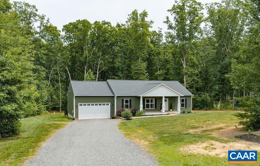 This meticulously maintained, single level home is nestled on a private lot just outside the town of Mineral. Light and bright with an open flow, the split plan has the primary suite on one side and the other two bedrooms on the other. Spacious living room, dining area, and a kitchen featuring granite counters, a large island, pendant lighting, pantry, and stainless appliances. The primary suite has a walk-in closet and dual vanity. The oversized, two-car garage has additional room for storage. Off the dining area is access to the back deck, perfect for grilling and relaxation. The backyard, fenced and ready for pets or little ones, includes a fire pit for outdoor gatherings against a backdrop of the surrounding woods. Lot is 1.54 acres. Undeveloped neighboring property owned by HOA, so not buildable. Minutes from grocery stores, restaurants, and beautiful Lake Anna. 40 min from Charlottesville and under an hour from Richmond and Fredericksburg.,Granite Counter
