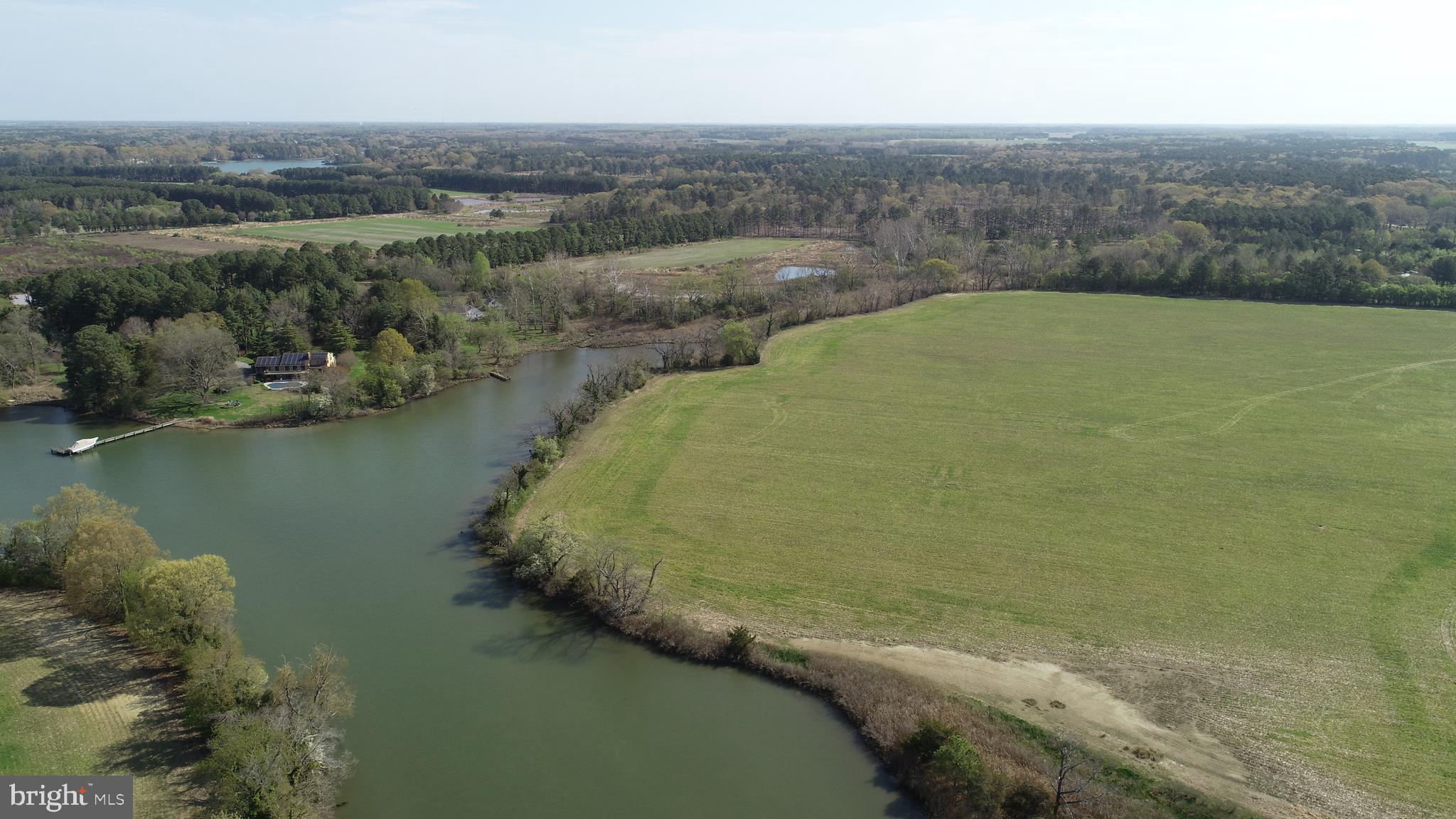 Welcome to an amazing farm opportunity located 3 miles from Oxford, Maryland, one of the Eastern Shore’s most treasured waterfront towns,  where timeless charm meets an exceptional opportunity to create your dream home. 
Set along the shores of Goldsborough Creek, this premier waterfront parcel offers northwestern exposure, delivering breathtaking sunset views across tranquil waters.
The preferred waterfront building site allows for construction with a 100-foot setback, providing nearly 180 degrees of waterfront views on Goldsborough Creek.  A proposed 150-foot private dock site would provide approximately 2.5 feet at mean low tide.
A recent septic application with the Talbot County Health Department has been submitted for a four-bedroom residence. Soil evaluations indicate excellent conditions for a generous sewage disposal area, offering flexibility for a substantial home and the potential for future improvements. Engineering analysis also supports the possibility of identifying additional SDA locations should subdivision be pursued, subject to county approvals.  Preliminary estimates show the potential for 2 waterfront and 1 inland building site, to be confirmed with Talbot County Planning and Zoning.
The farm is located within a historic waterfowl staging area providing habitat for wintering Canada Geese and Ducks.  Adjacent woodland and contiguous farm fields complement this coveted rural setting with ample opportunity to enhance the natural features and create a haven for the outdoors and nature enthusiasts.
This unique waterfront farm opportunity provides an extraordinary setting to design and build a custom waterfront retreat in a location defined by the natural beauty where land and water combine.