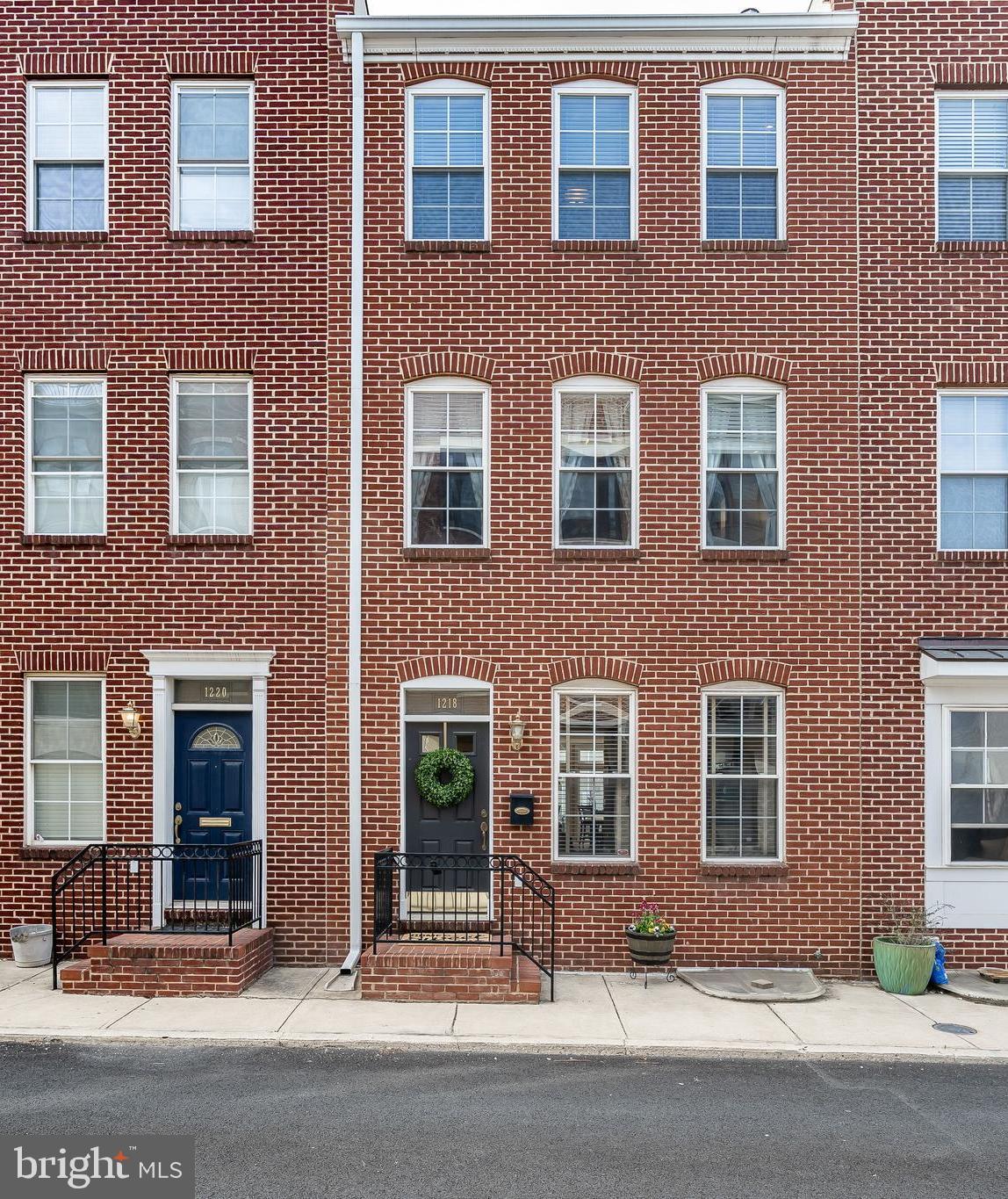 Welcome to Hull Street Mews!! This fabulous 4 bedroom, 4.5 bath home offers over 3000 sq. ft of living space, 2 car parking, finished basement, and roof deck with awesome water views! The convenient floor plan with entrance on main level features a cozy living room with wood floors and gas fireplace, formal dining room, and a beautiful cherry kitchen with stainless steel appliances including new dishwasher, option for gas cooking and walk in pantry. Upstairs you will find the sunny master suite with generous closet space, master bath with double sinks, jacuzzi tub and walk in shower plus another large bedroom with private bath. Third level includes a bedroom w/private bath and a huge family room with balcony and wet bar with wine fridge, making it the perfect spot for relaxing or entertaining! Spend you summer watching the boats go by on the maintenance free Timber Tech roof deck with a direct gas line for the grill to enjoy outdoor dining. The finished basement boasts a large 4th bedroom and full bath plus a huge storage room for all of your extra stuff. Bonus features include new roof and deck installed in 2016, wiring for whole house audio system and direct gas hook up on main level and roof make it so you never have to replace propane tanks,this home is a must see!!
