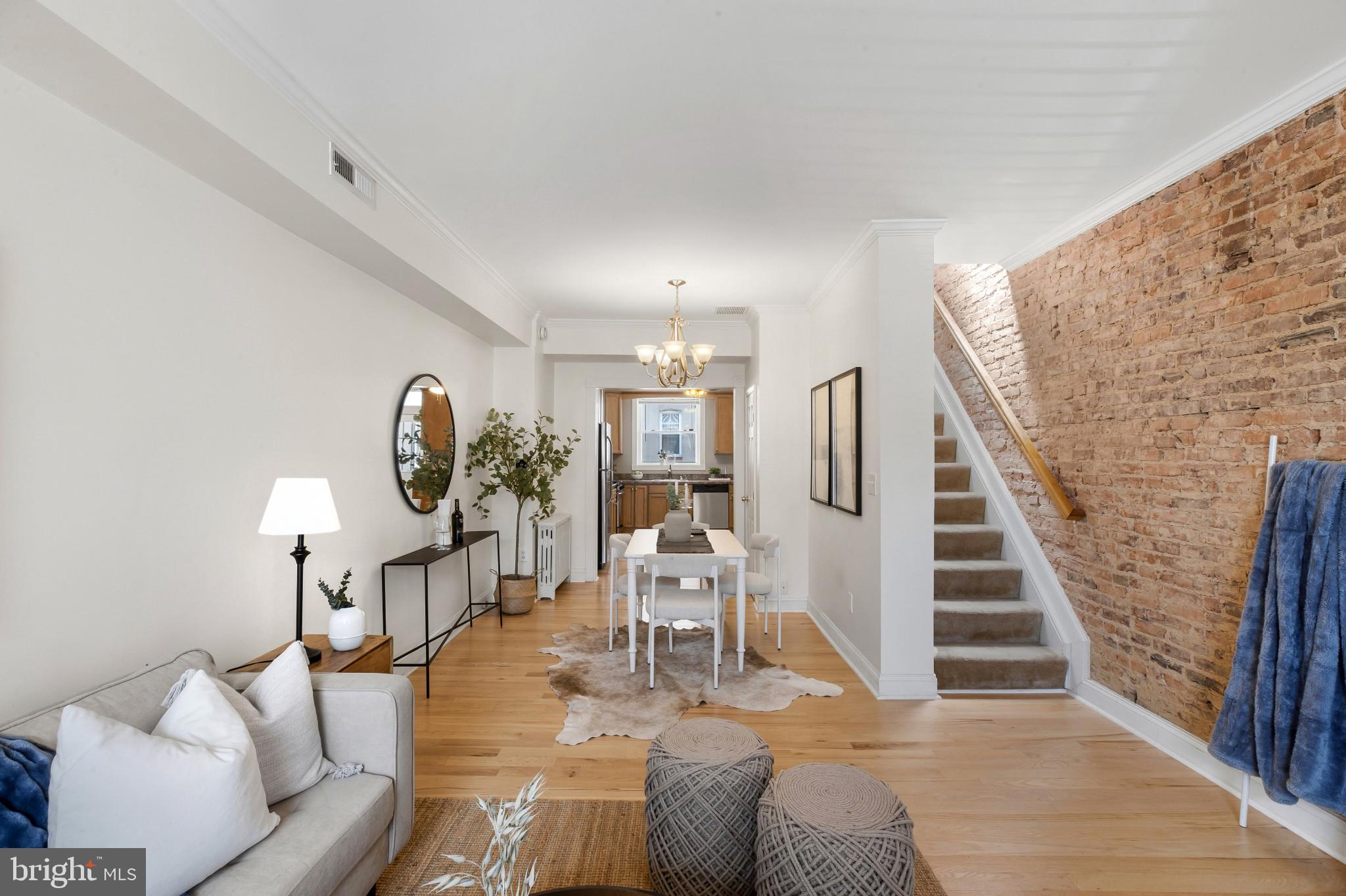 Welcome to 3705 Foster Avenue, a beautifully maintained Brewers Hill rowhome that perfectly blends historic Baltimore charm with modern comfort. Featuring private parking, exposed brick, gleaming hardwood floors, and an abundance of natural light throughout, this home offers the lifestyle today's buyers are searching for.

The main level showcases an inviting open-concept layout with warm hardwood flooring, timeless exposed brick accents, and large windows that flood the space with sunlight. The kitchen flows seamlessly to the rear PARKING PAD so you can easily park anysize car.  

Upstairs, you'll find spacious bedrooms, including a primary suite with a massive walk-in closet rarely found in city homes. Thoughtfully designed living spaces and generous storage make everyday living both comfortable and functional.

The finished lower level adds exceptional flexibility with a full bathroom and ample space for a guest suite, home office, gym, media room, or potential additional bedroom. New carpet will be installed, providing a fresh and updated feel for the next owner.

Located in the heart of Brewers Hill, you'll enjoy easy access to Canton, Patterson Park, the waterfront, shopping, dining, and major commuter routes. Combining character, convenience, outdoor space, and private parking, 3705 Foster Avenue delivers everything buyers love about city living.

Don't miss the opportunity to own this bright, spacious, and move-in-ready home in one of Baltimore's most sought-after neighborhoods.