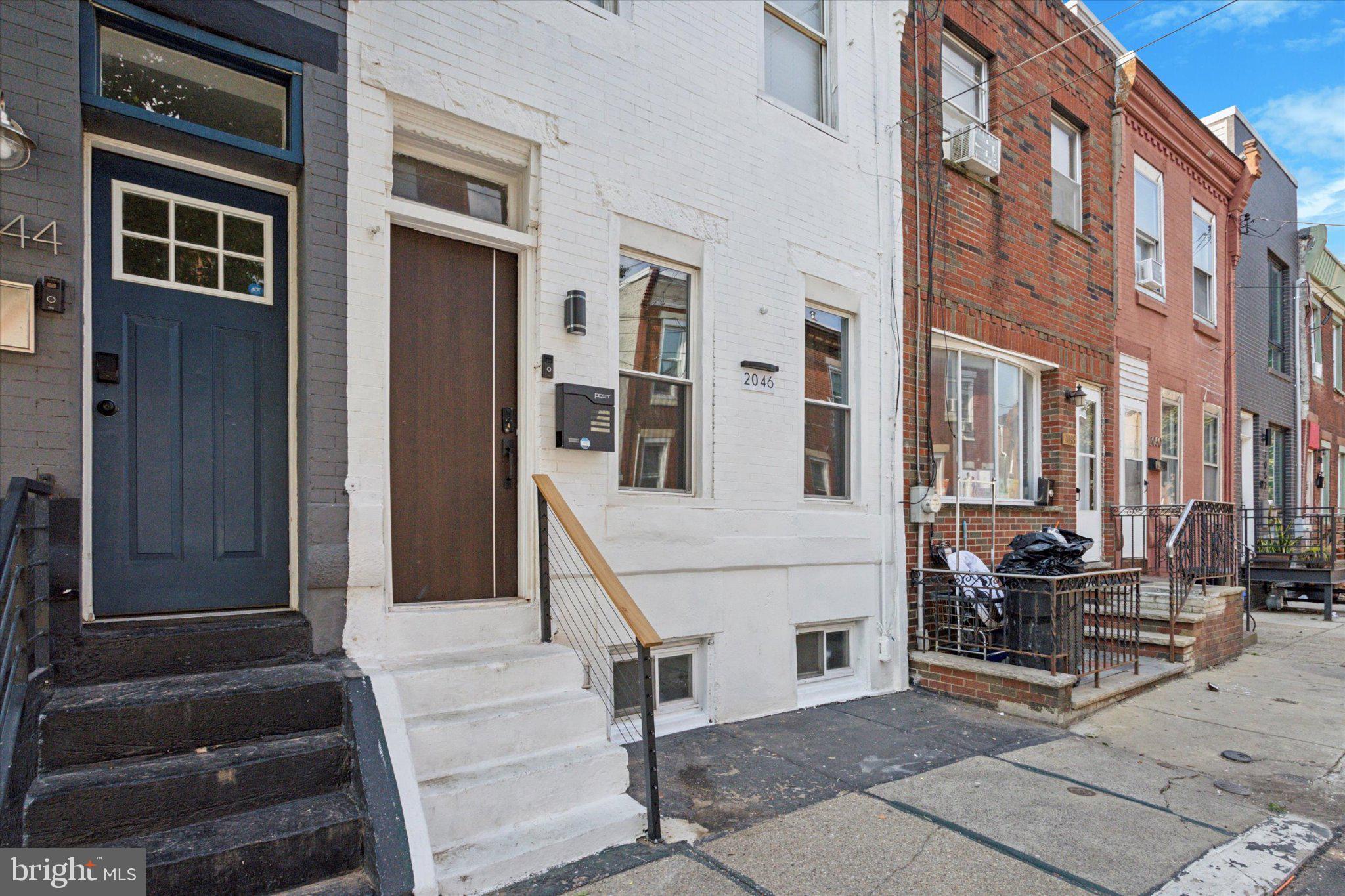 Renovated home in Point Breeze! New flooring throughout the home! Starting in the living room, new flooring, new light fixtures and a feature wall. Mini-Split system on the main floor to keep cool on those hot summer days. There is a half bathroom on the main floor as well. Barnyard door to the finished basement in the dining room. Step into the renovated kitchen with new tile, oven, built-in dishwasher (matches the kitchen cabinets), new cabinets and shelves. Up the refinished stairs, to the second floor you will see the new floors continue throughout. Freshly updated bedrooms as well, with the Main Bedroom having it's own Mini-Split to stay cool in the summer. In the renovated full bathroom you will find new tile floors, vanity and tiled shower stall! The basement has been finished to add around 200 SF additional living space to suit your needs! All furniture is included in the Home! This home has been on Air BnB as a short term rental and rented out for $2700 per month. Make an appointment to see this Home today!